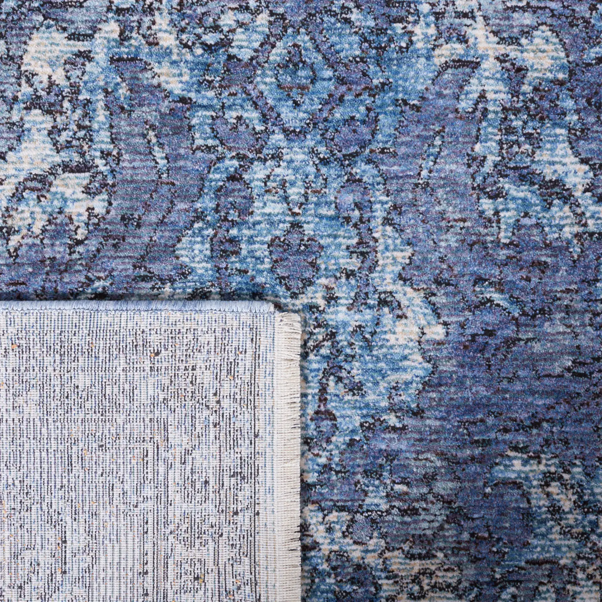 Moondust Distressed Arabesque Rug in Blue / Turquoise in a styled room