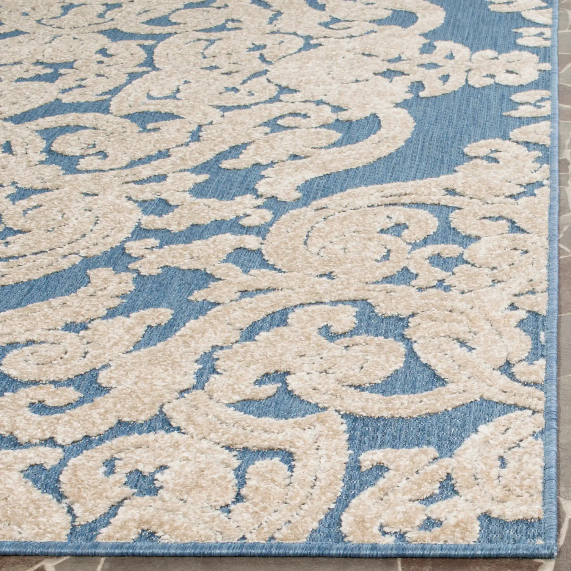 Monroe Damask Rug in Blue in a styled room