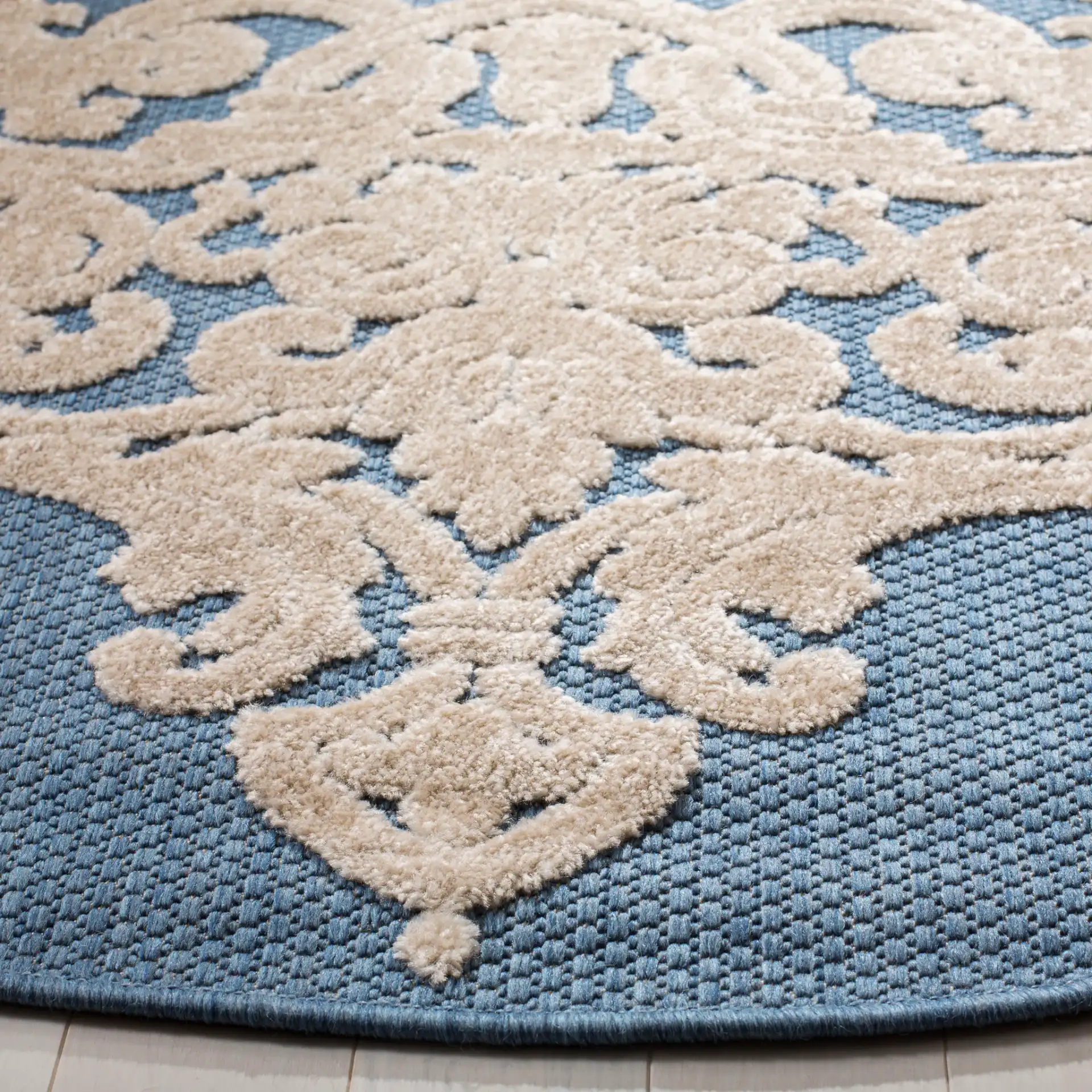 Monroe Damask Rug in Blue in a styled room
