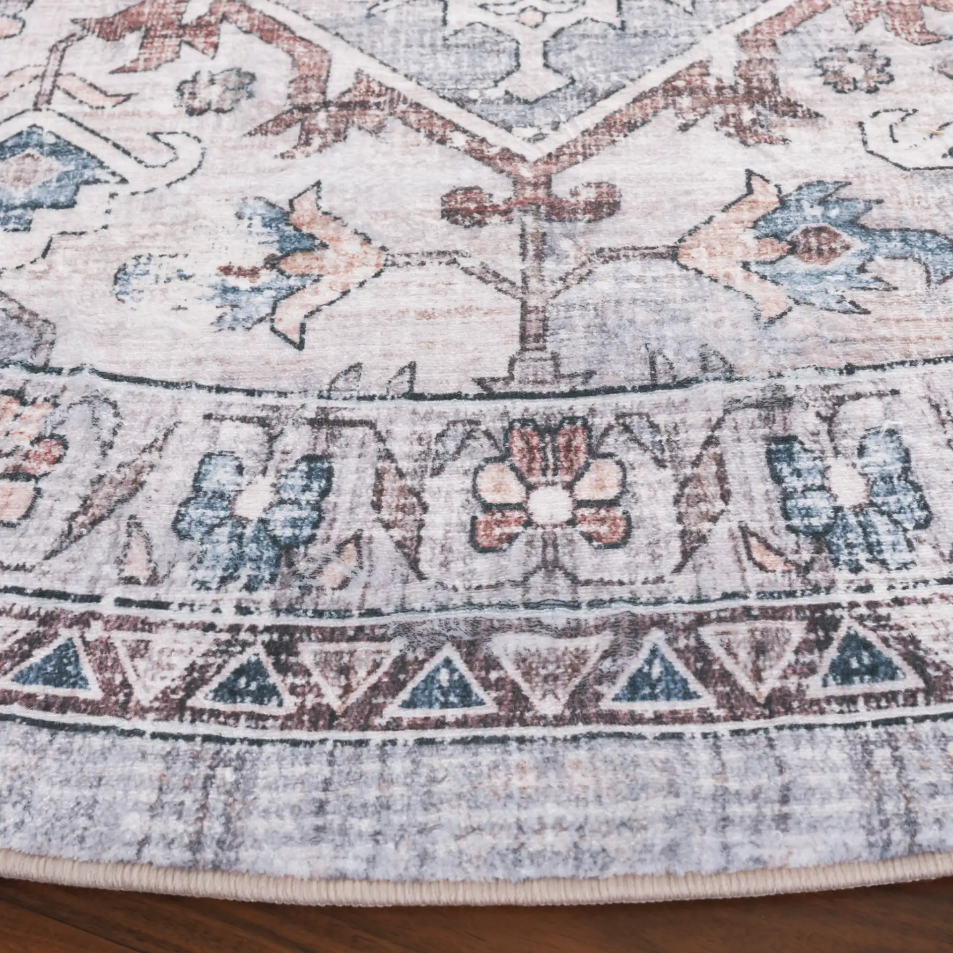 Montana Medallion Bordered Rug in Gray / Blue in a styled room