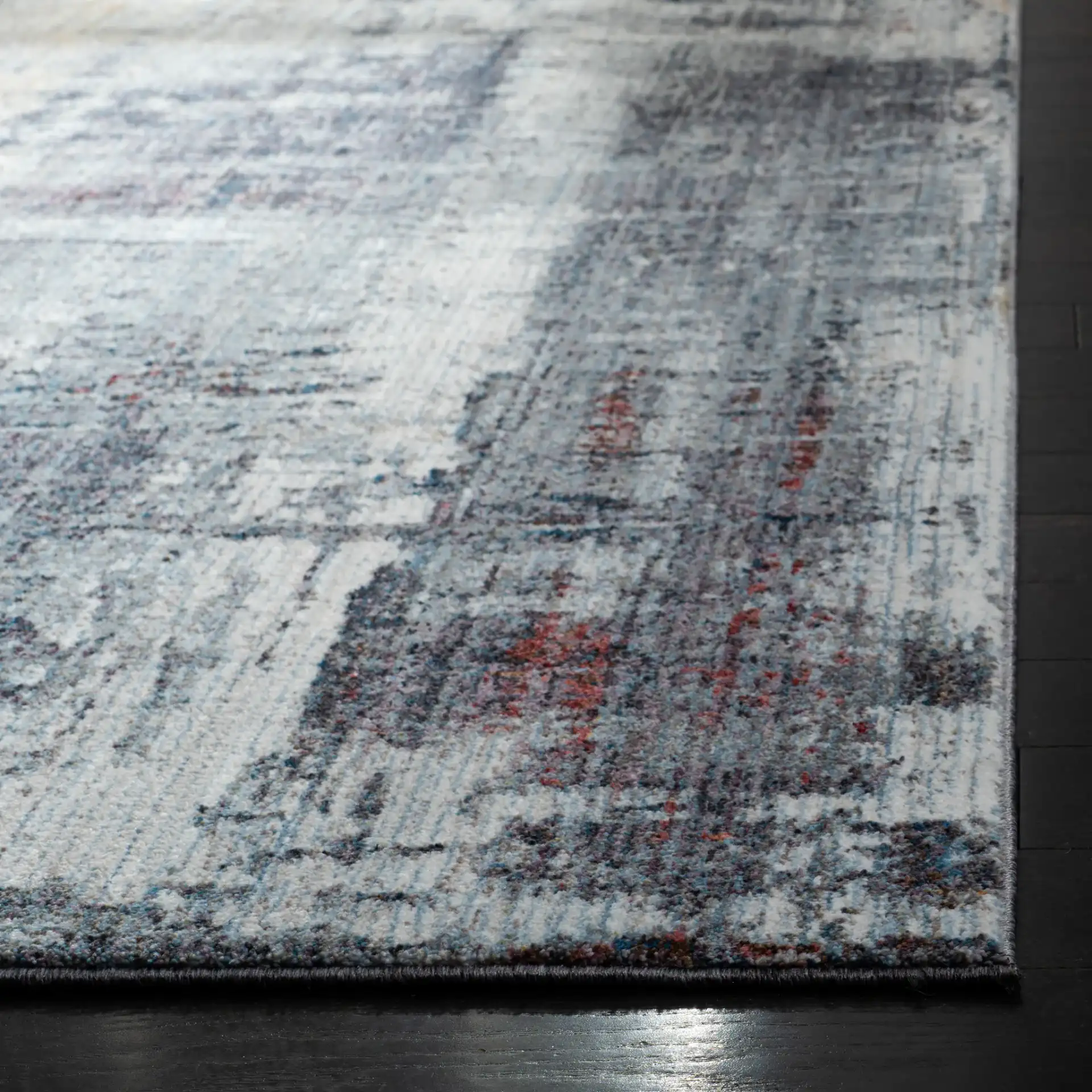 Monray Abstract Rug in Charcoal / Ivory in a styled room