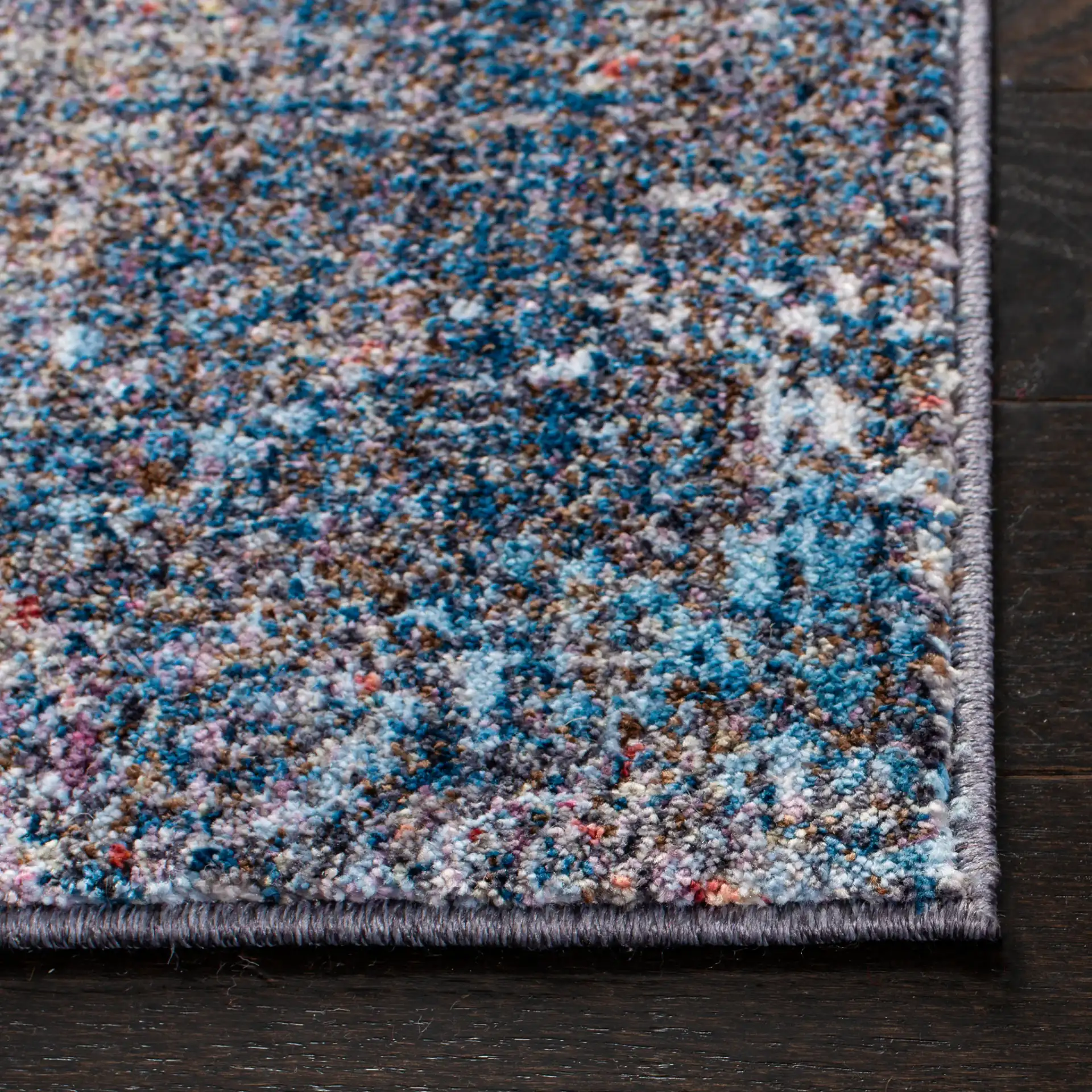 Monray Painterly Abstract Rug in Blue / Multicolor in a styled room