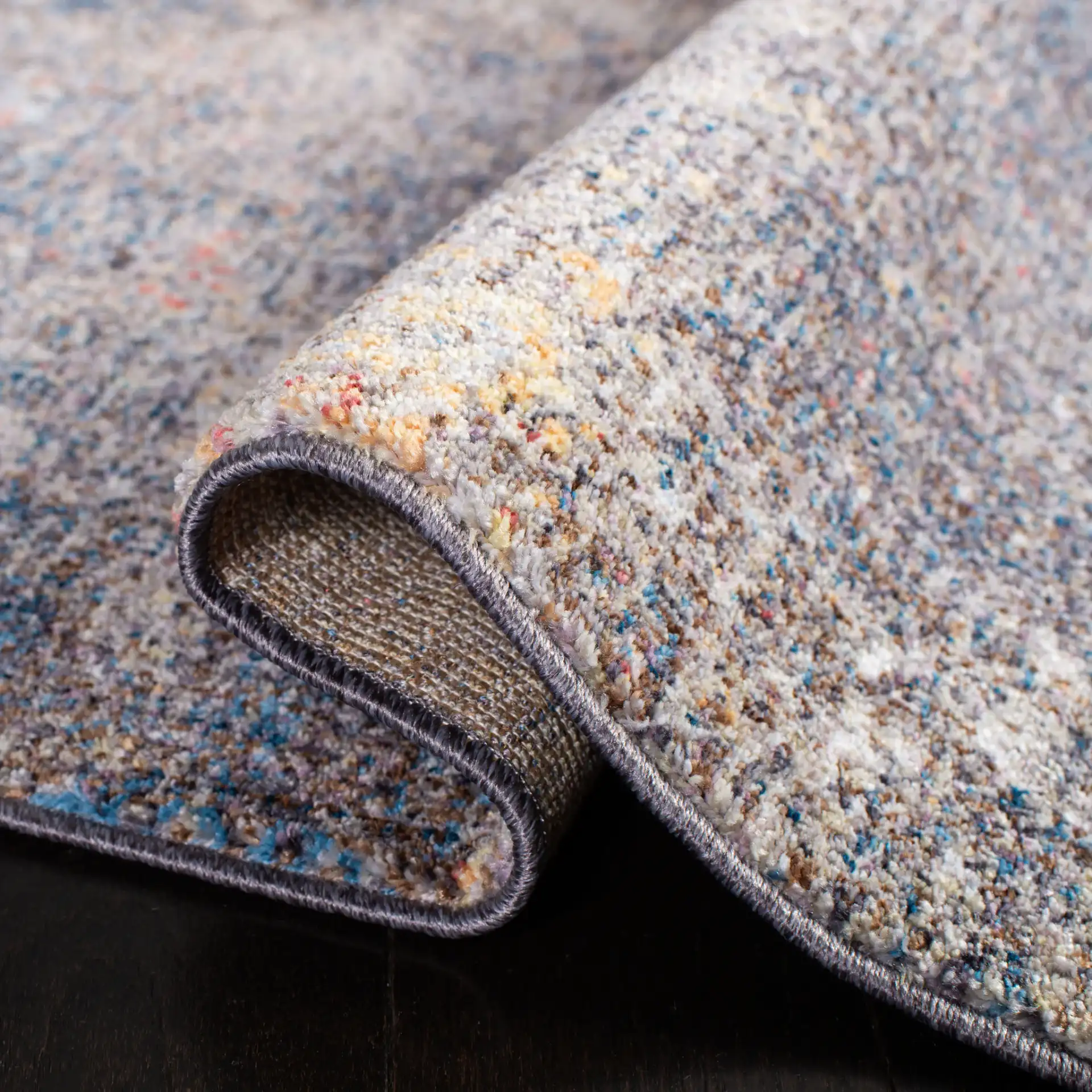 Monray Painterly Abstract Rug in Blue / Multicolor in a styled room