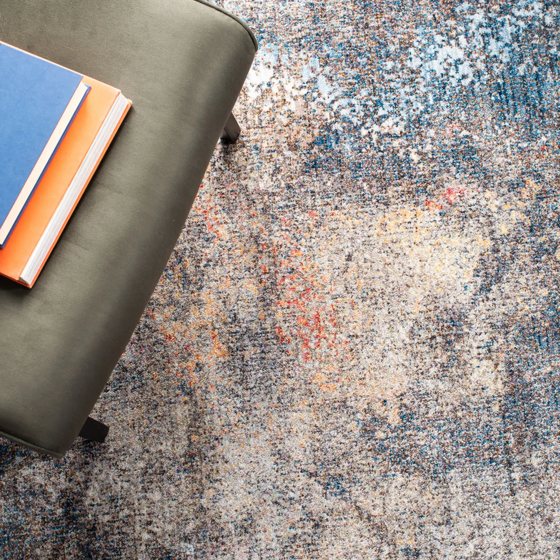 Monray Painterly Abstract Rug in Blue / Multicolor in a styled room
