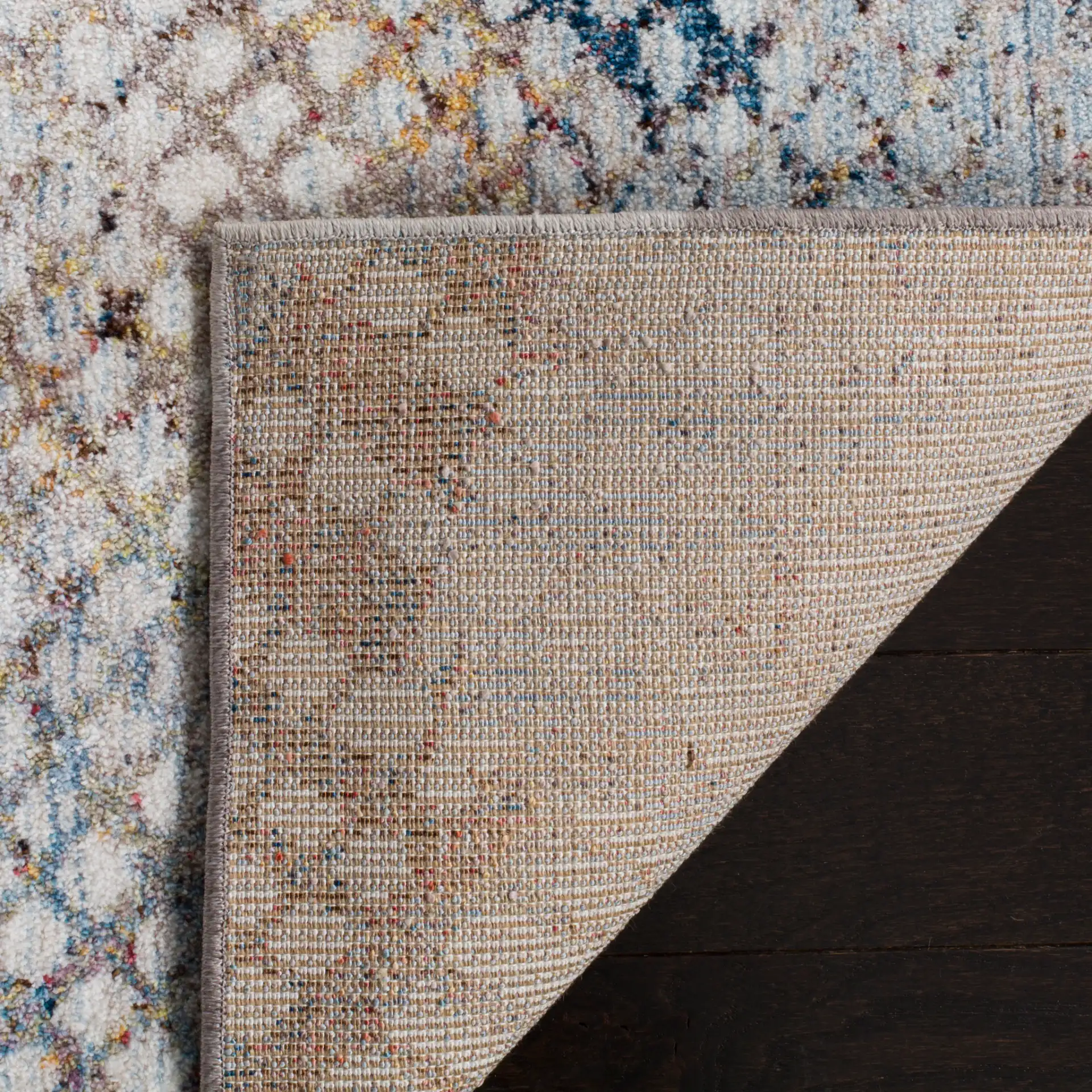 Monray Distressed Grid Rug in Gray / Gold in a styled room