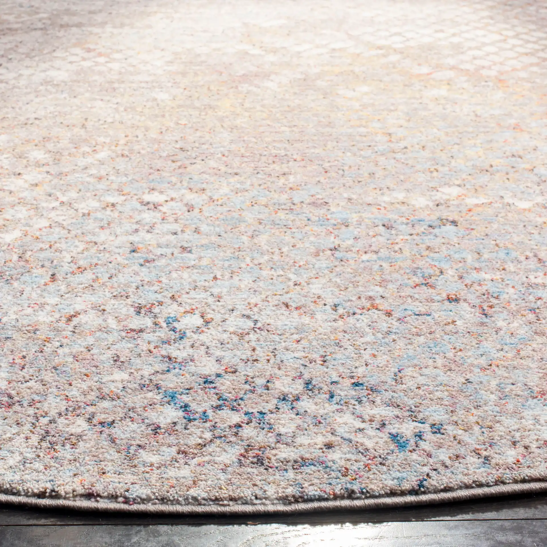 Monray Distressed Grid Rug in Gray / Gold in a styled room