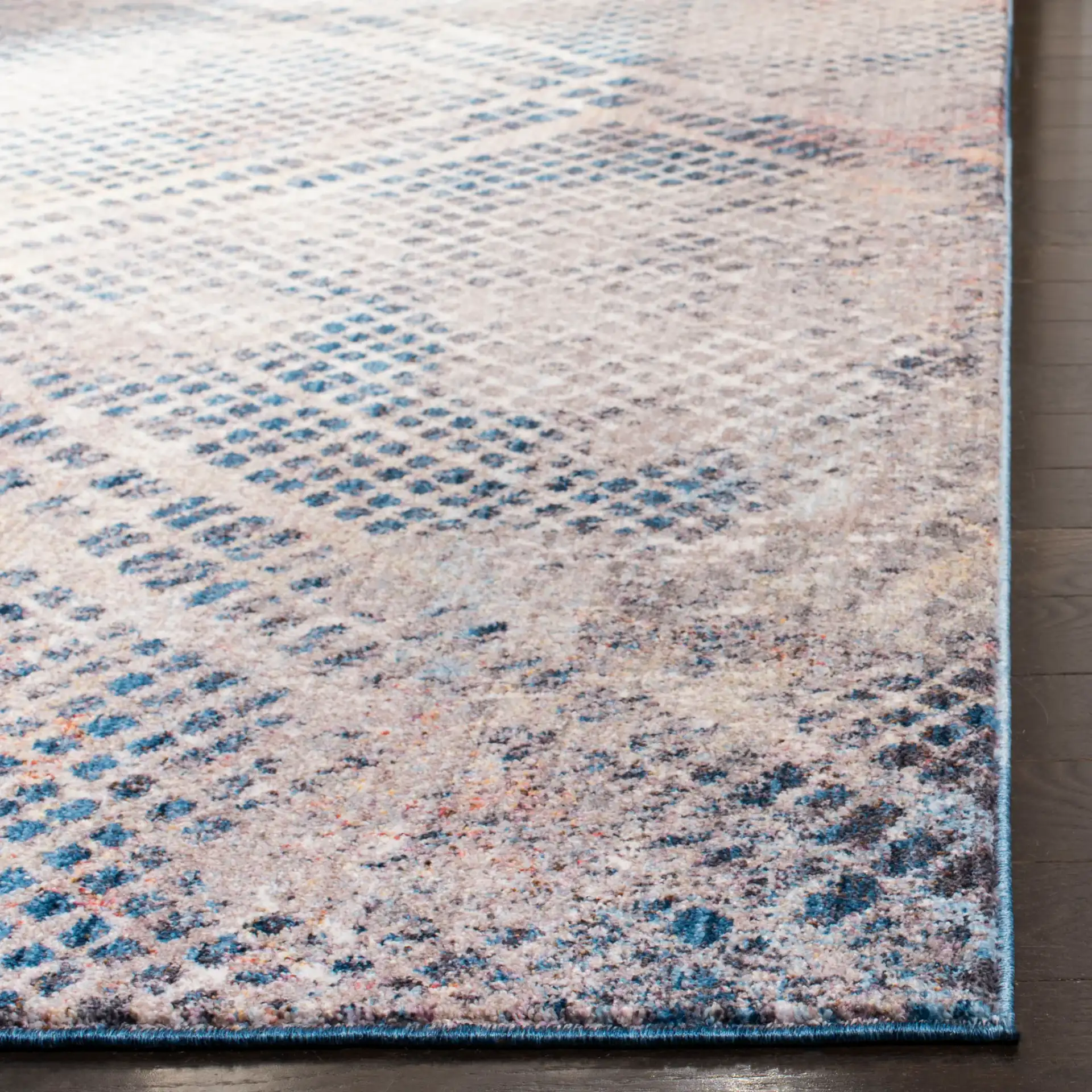 Monray Distressed Grid Rug in Blue / Multicolor in a styled room