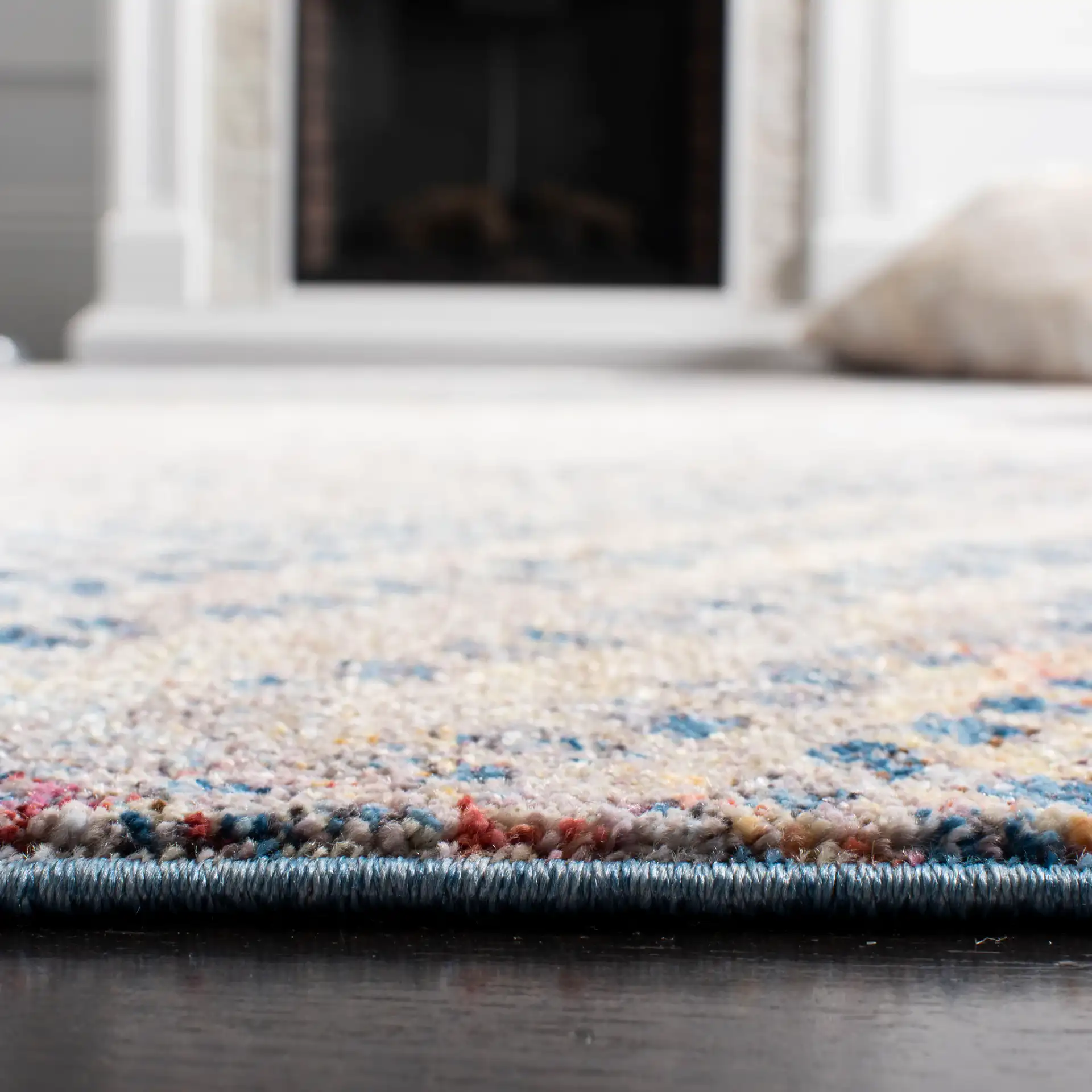 Monray Distressed Grid Rug in Blue / Multicolor in a styled room