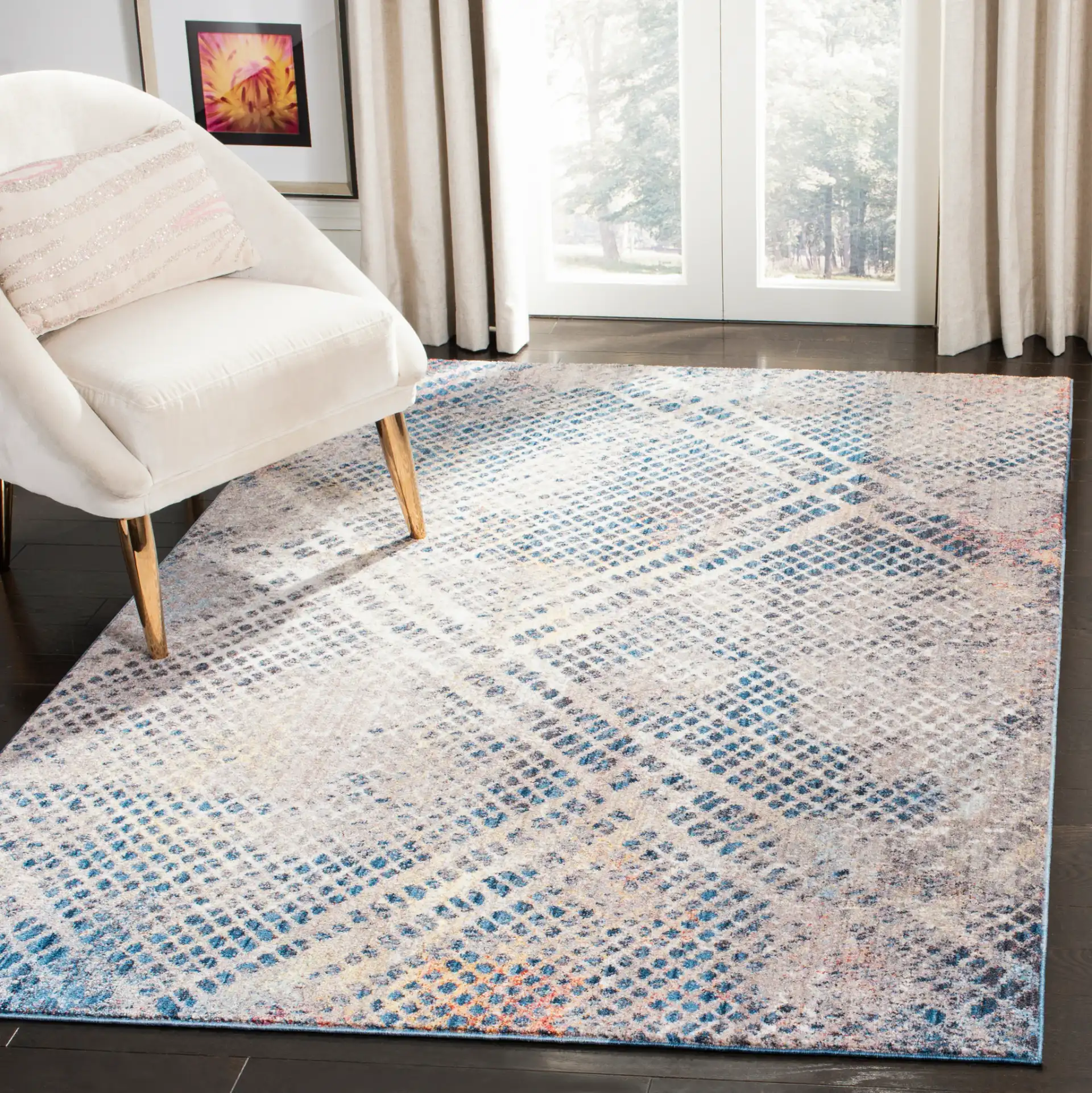 Monray Distressed Grid Rug in Blue / Multicolor in a styled room