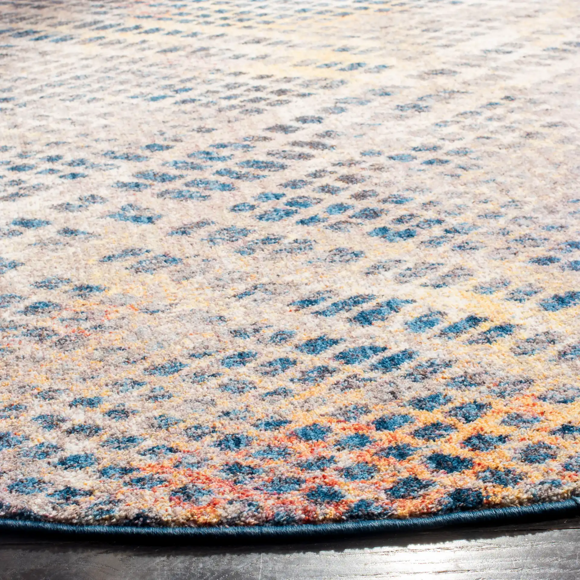 Monray Distressed Grid Rug in Blue / Multicolor in a styled room