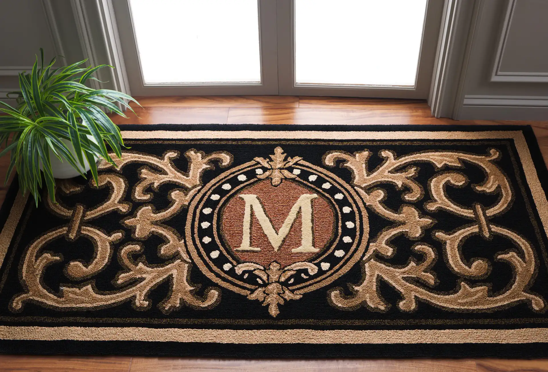 Monogram Berkeley Scrollwork Hand-Hooked Outdoor Rug in Black in a styled room