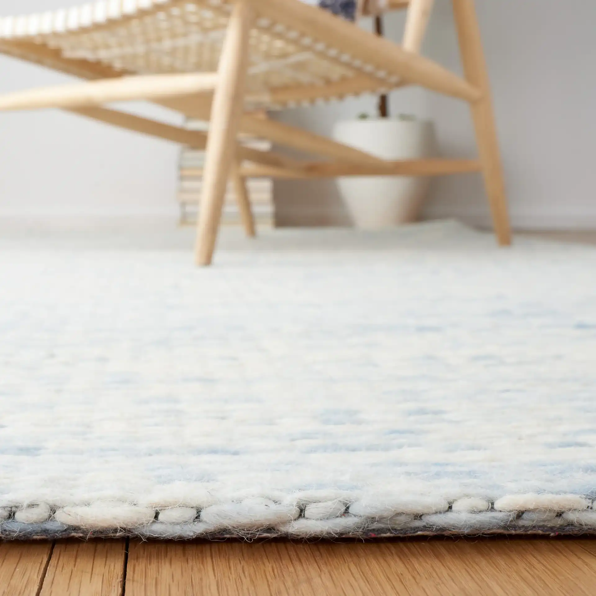 Marbella Striated Hand-Woven Wool Rug in Blue / Ivory in a styled room
