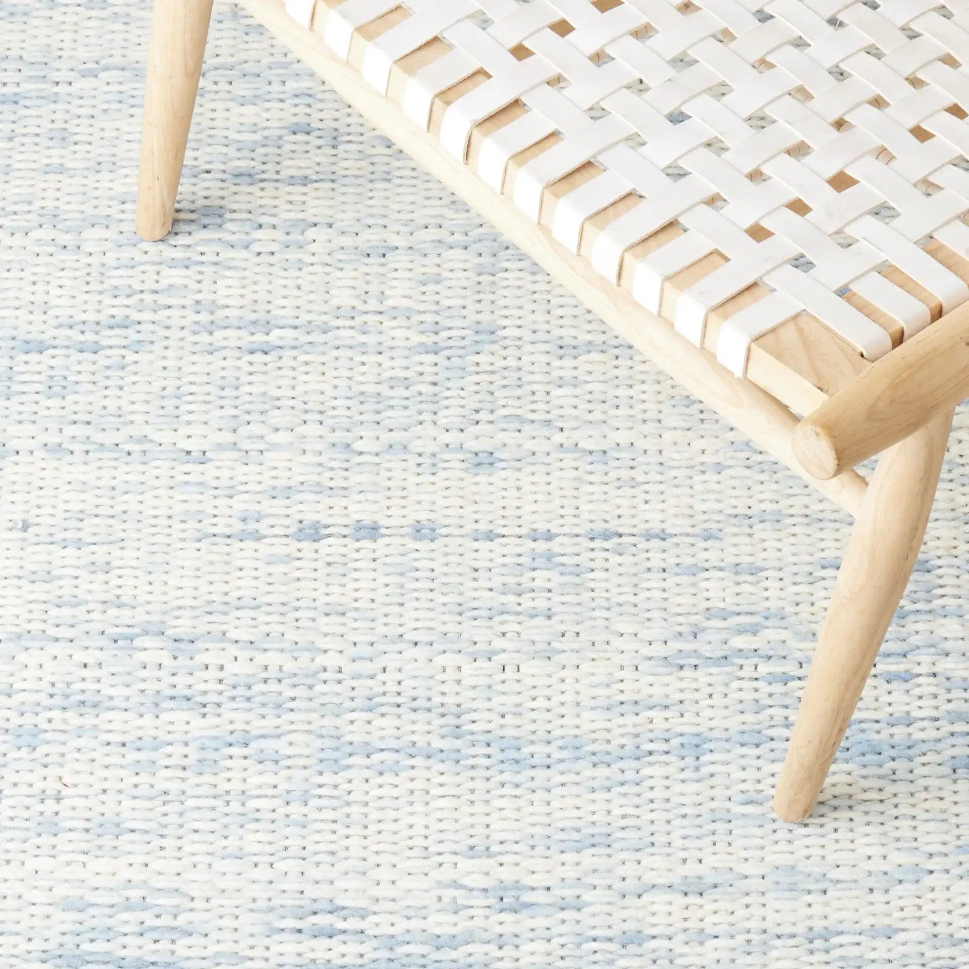 Marbella Striated Hand-Woven Wool Rug in Blue / Ivory in a styled room