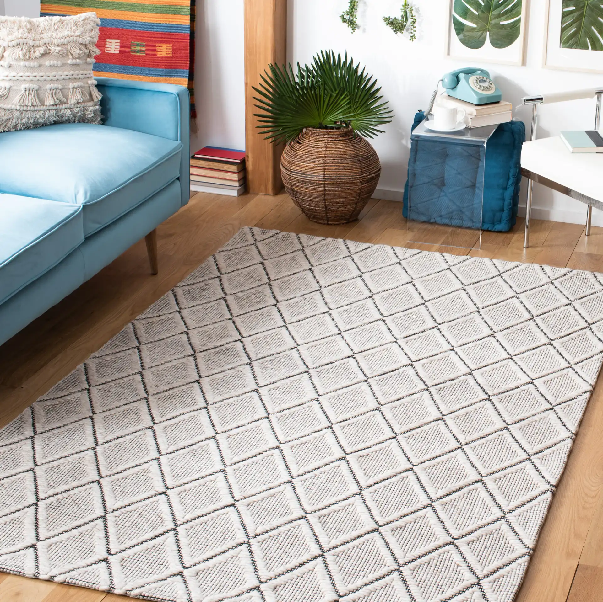 Marbella Diamond Trellis Hand-Woven Wool Rug in Silver / Black in a styled room