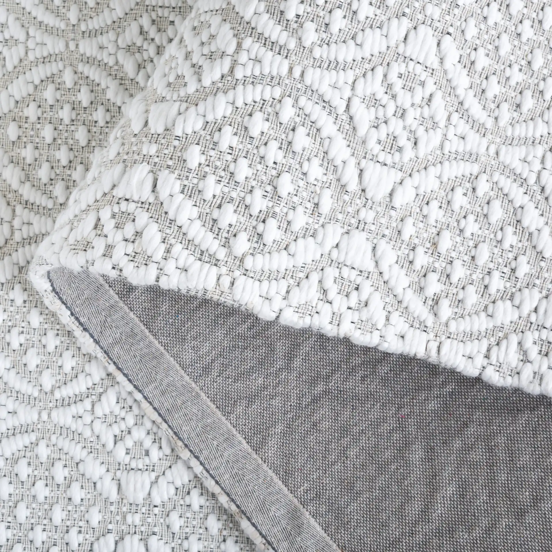 Marbella Interlocking Circles Hand-Woven Rug in Ivory in a styled room