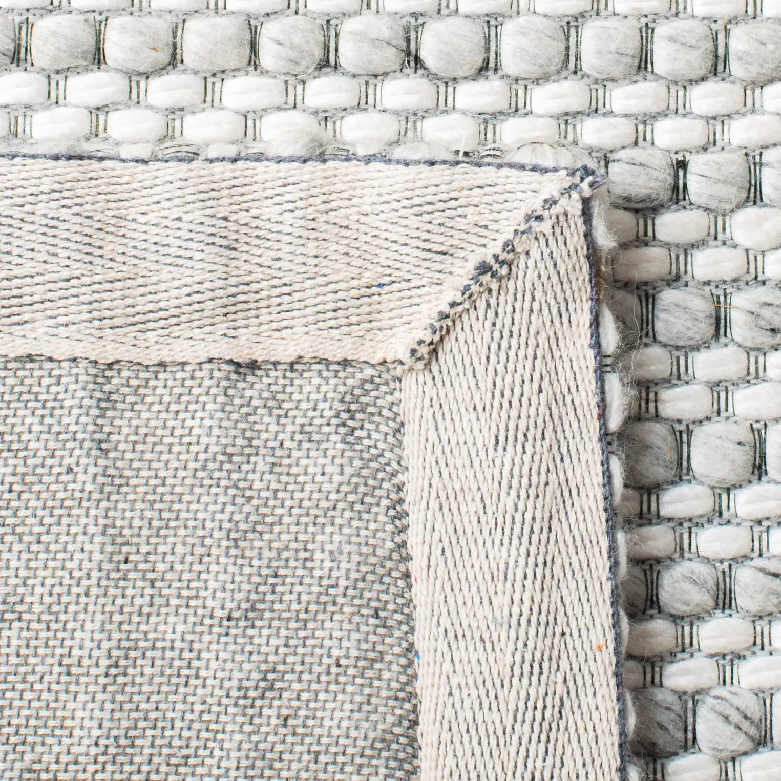 Marbella Textured Solid Flatweave Wool Rug in Light Gray / Ivory in a styled room