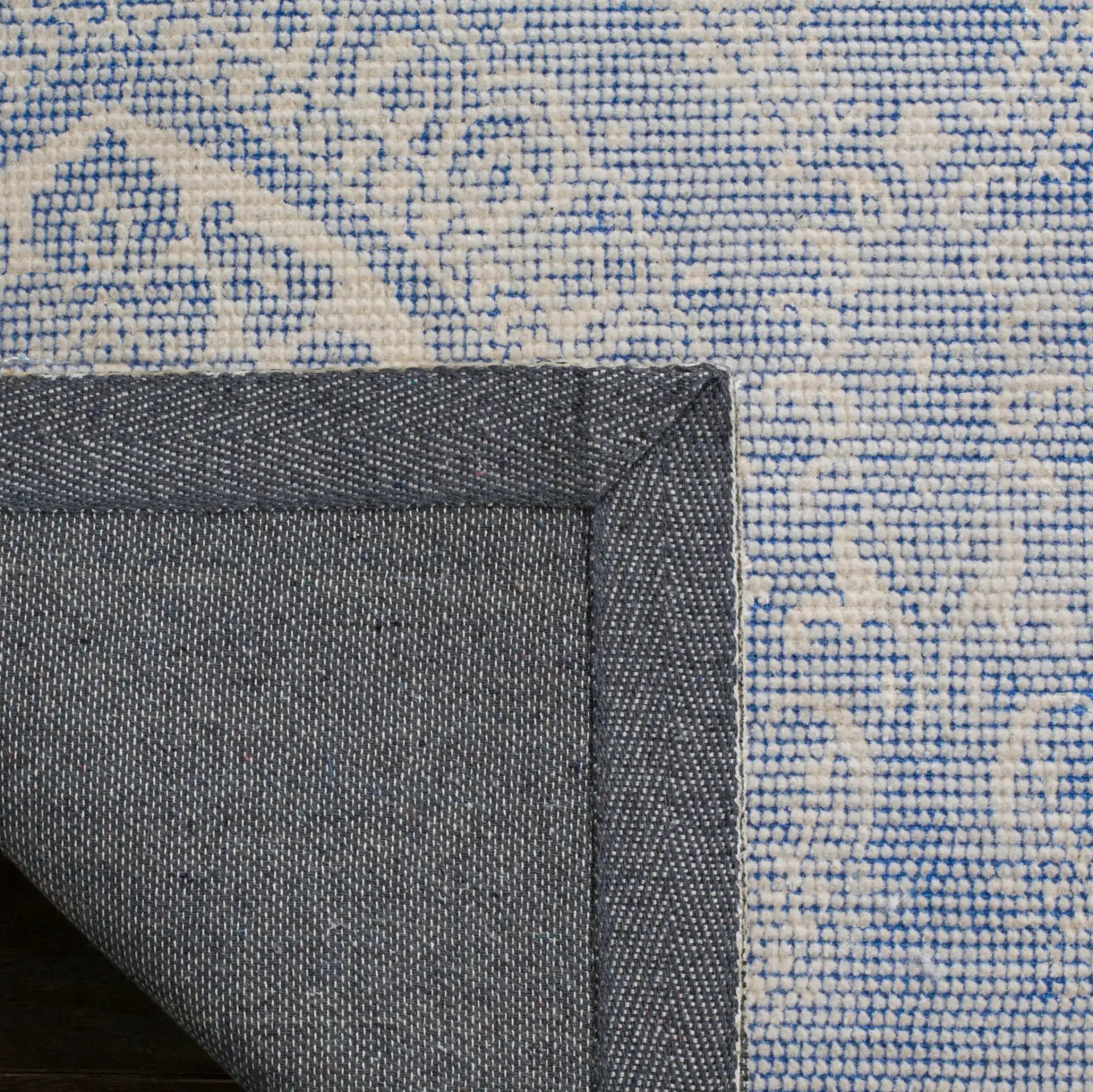 Marbella Damask Hand-Loomed Rug in Blue / Ivory in a styled room