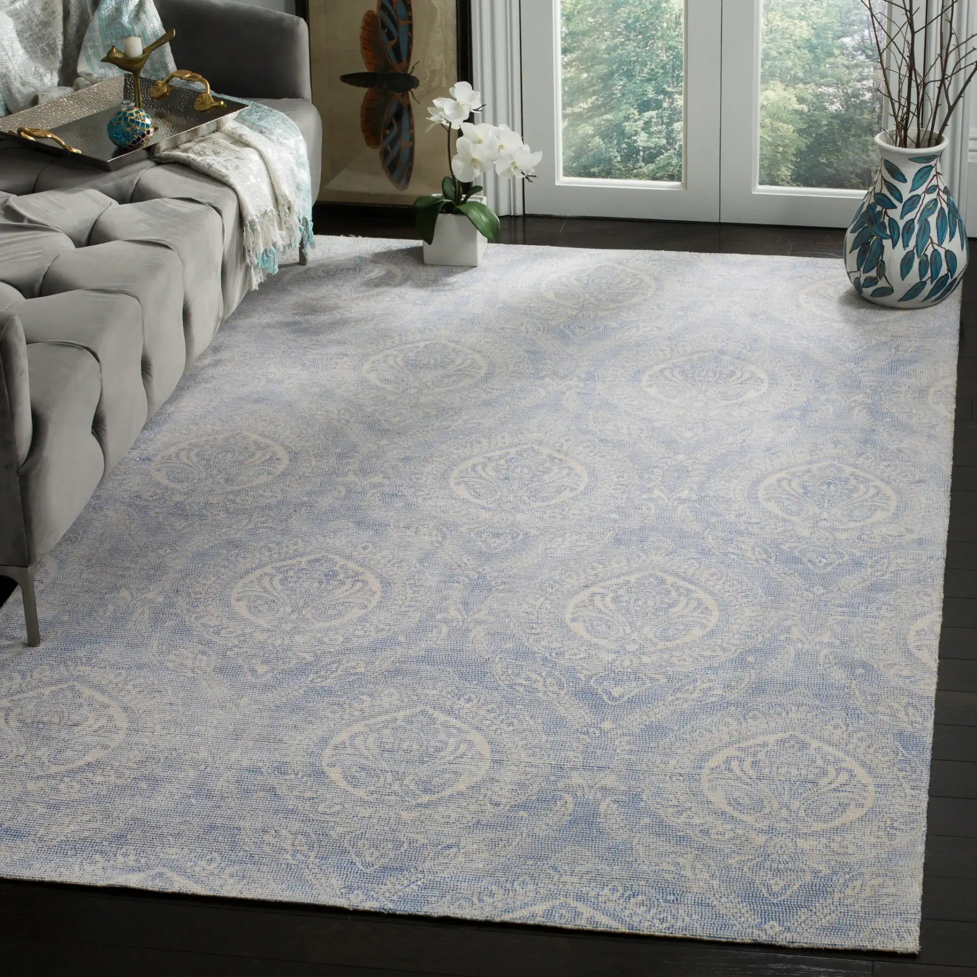 Marbella Damask Hand-Loomed Rug in Blue / Ivory in a styled room