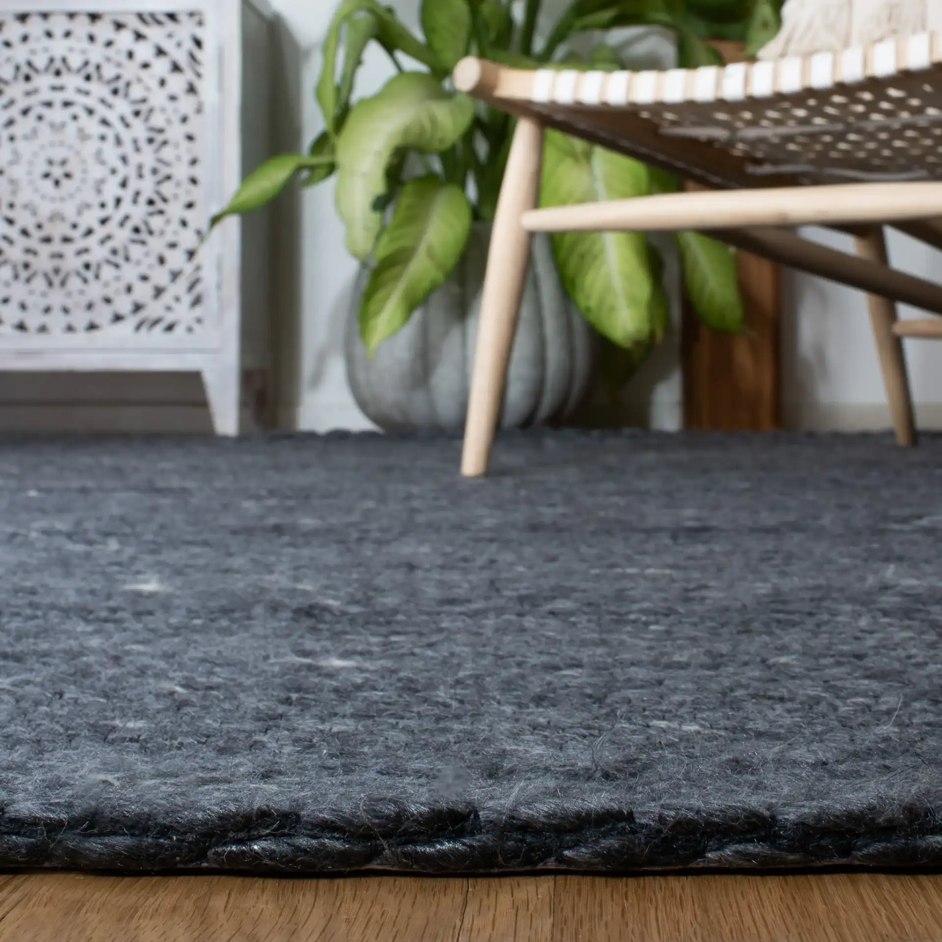 Marbella Speckled Ribbed Hand-Loomed Rug in Charcoal in a styled room