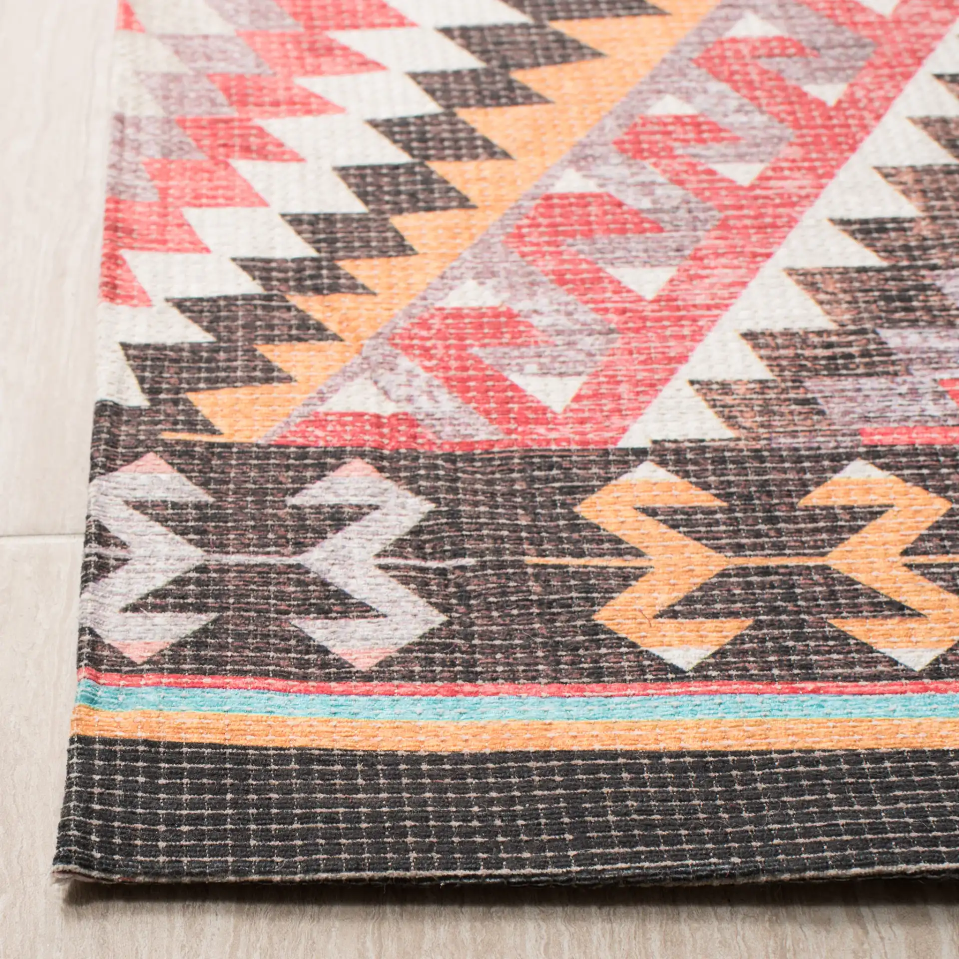 Marbella Southwestern Diamond Hand-Woven Rug in Red / Gold in a styled room