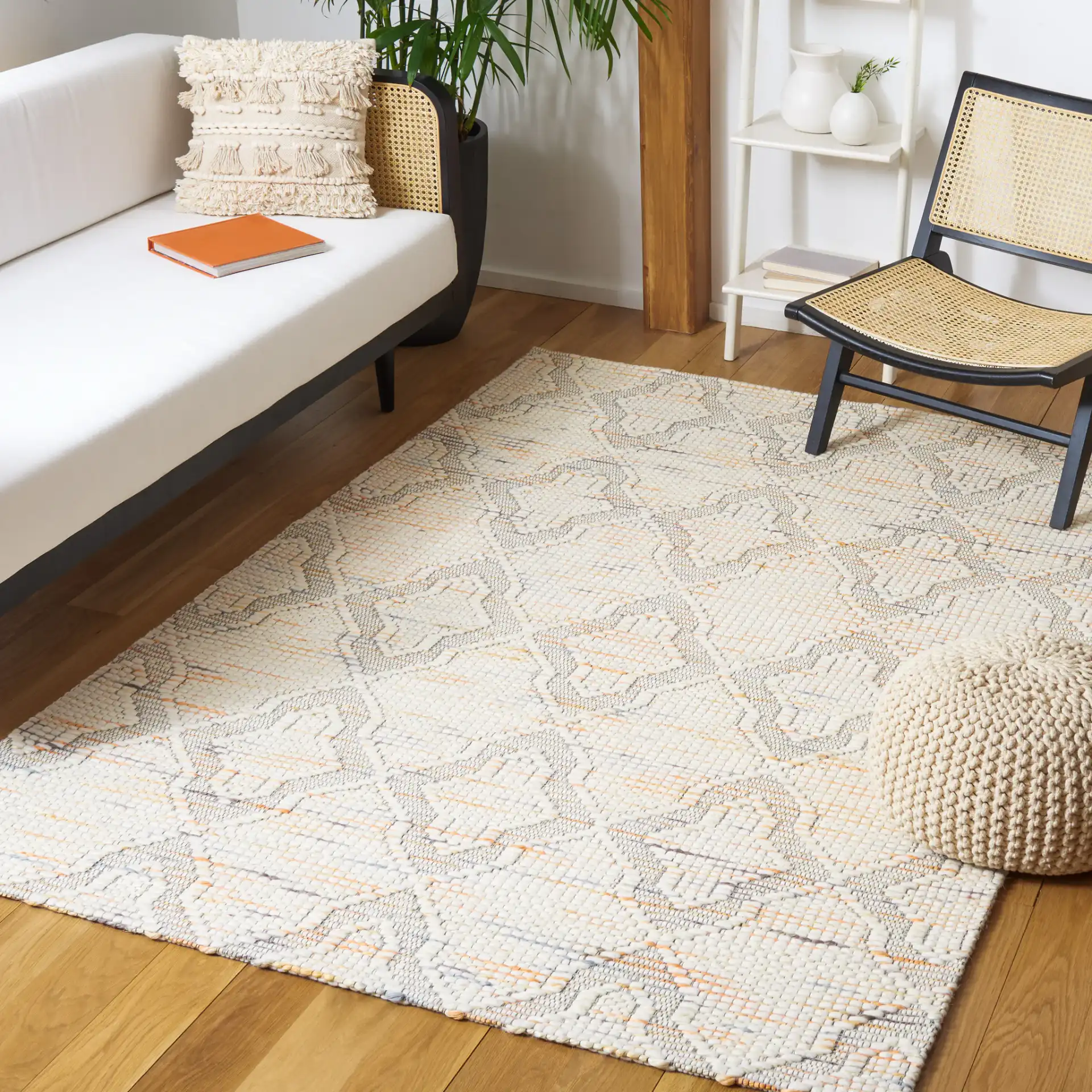 Marbella Ogee Trellis Hand-Loomed Rug in Ivory / Orange in a styled room