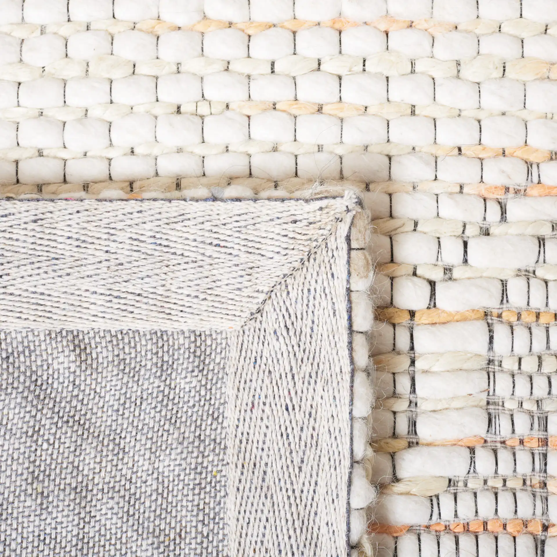 Marbella Ogee Trellis Hand-Loomed Rug in Ivory / Orange in a styled room