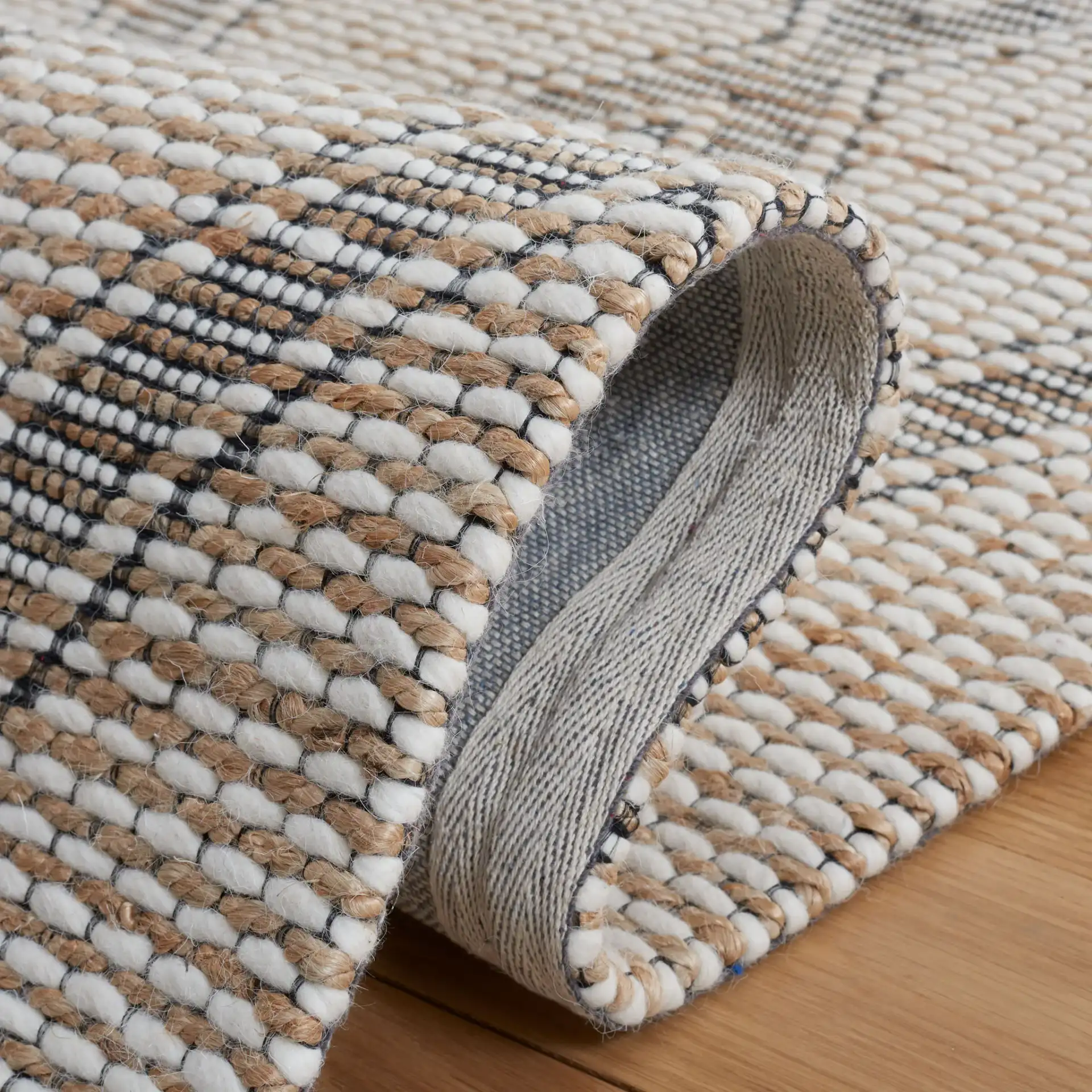 Marbella Modern Trellis Hand-Loomed Rug in Natural / Ivory in a styled room