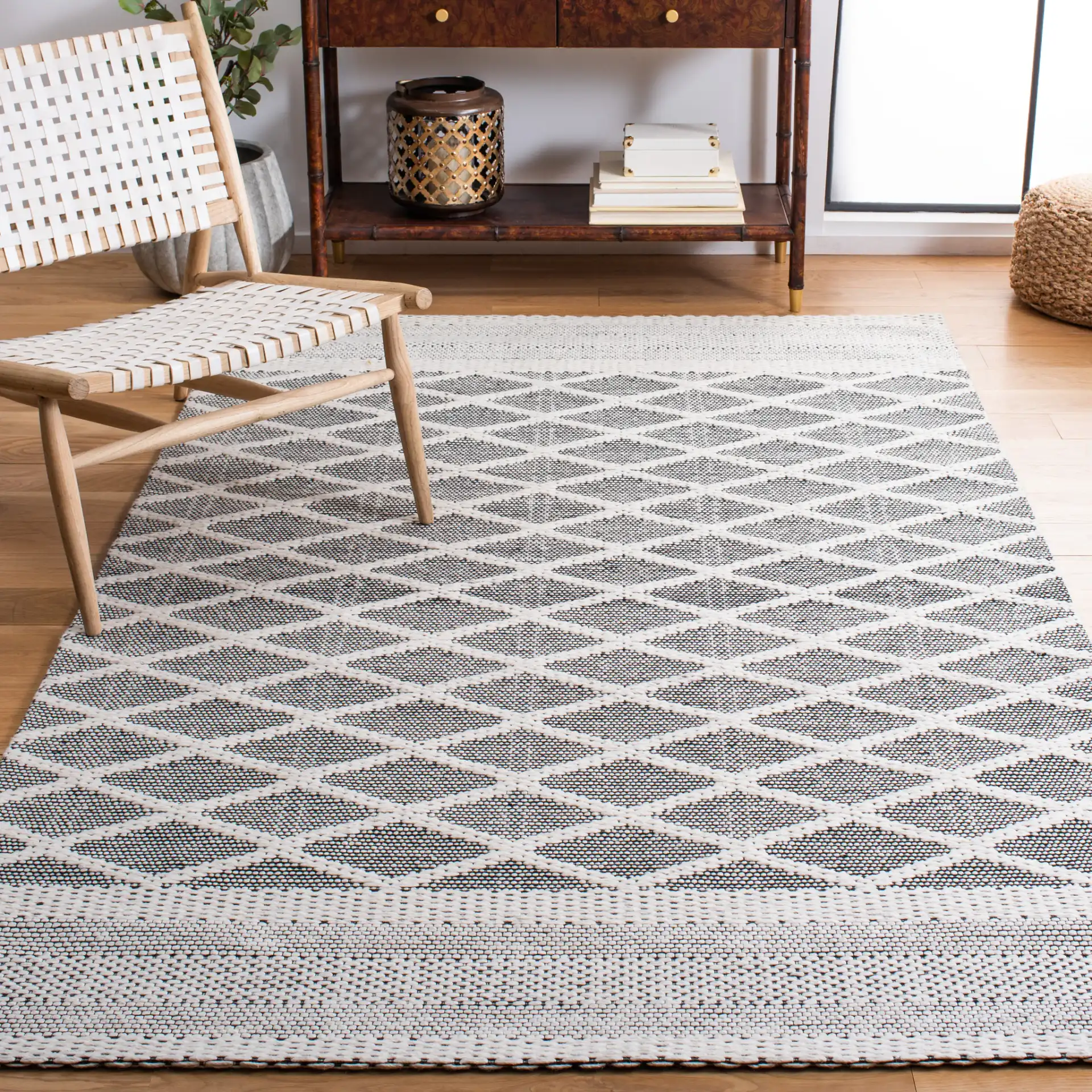 Marbella Banded Diamond Lattice Hand-Woven Wool Rug in Ivory / Black in a styled room