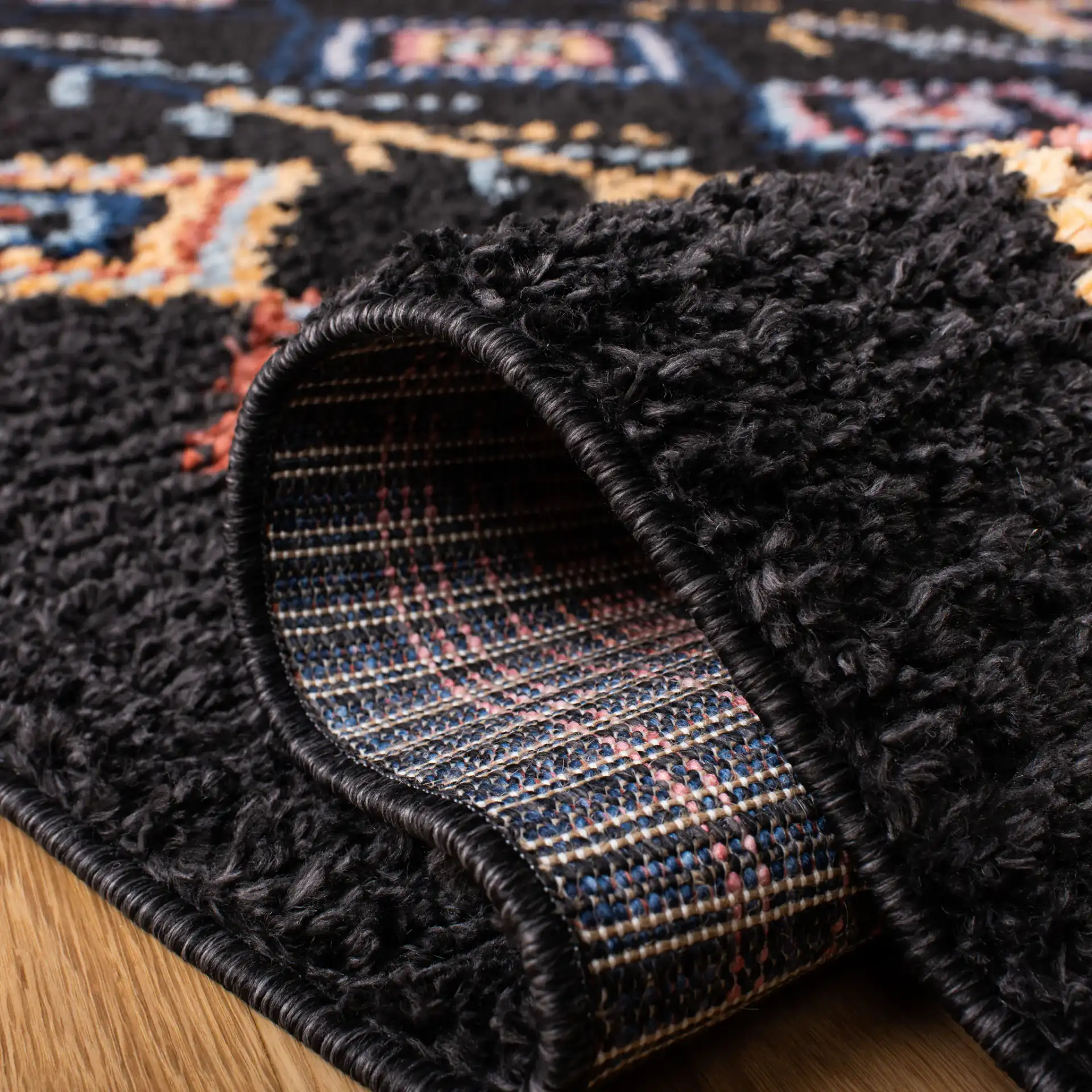 Morocco Diamond Column Shag Rug in Black / Navy in a styled room