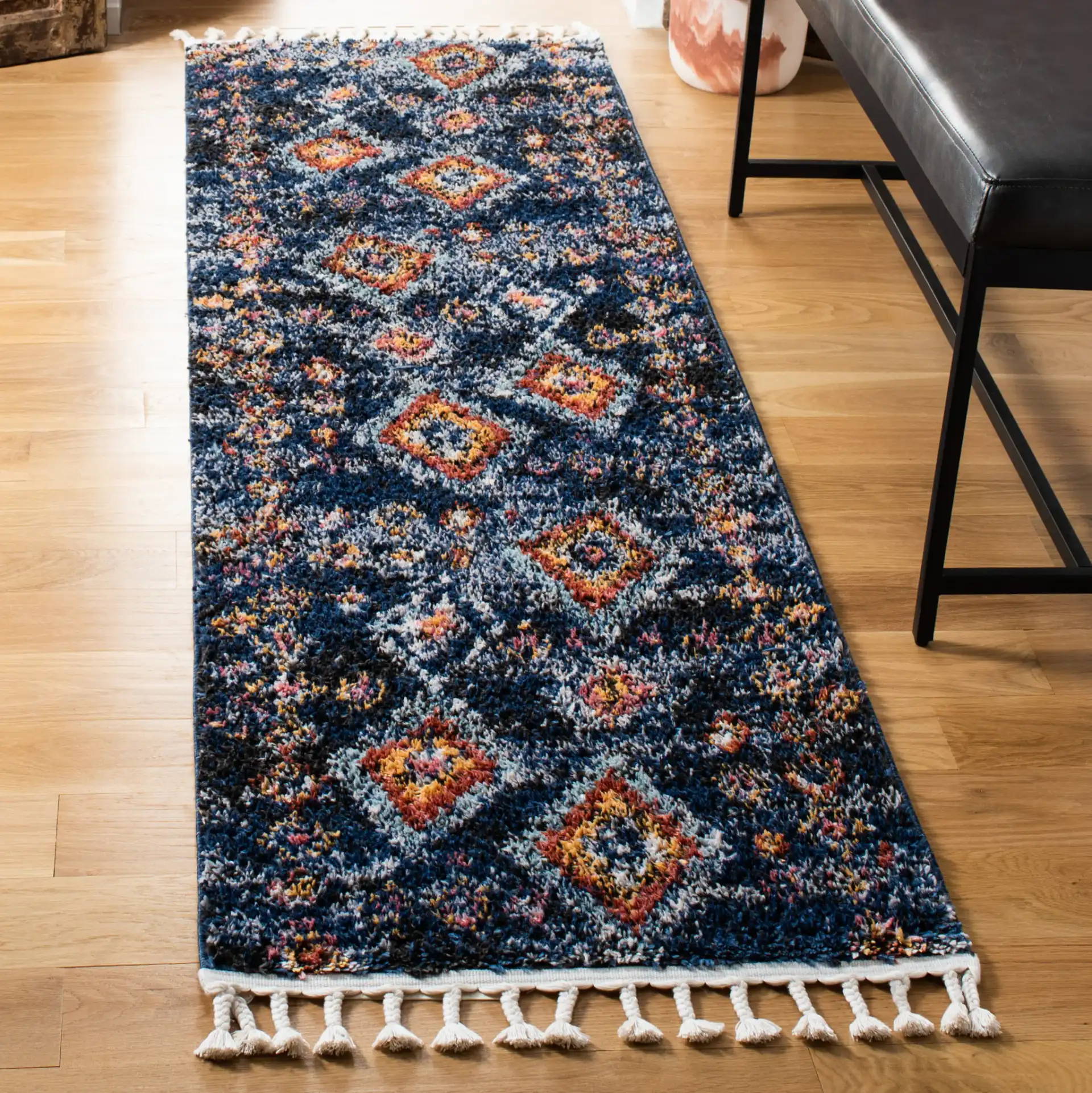 Morocco Nested Diamond Shag Rug in Navy / Multicolor in a styled room