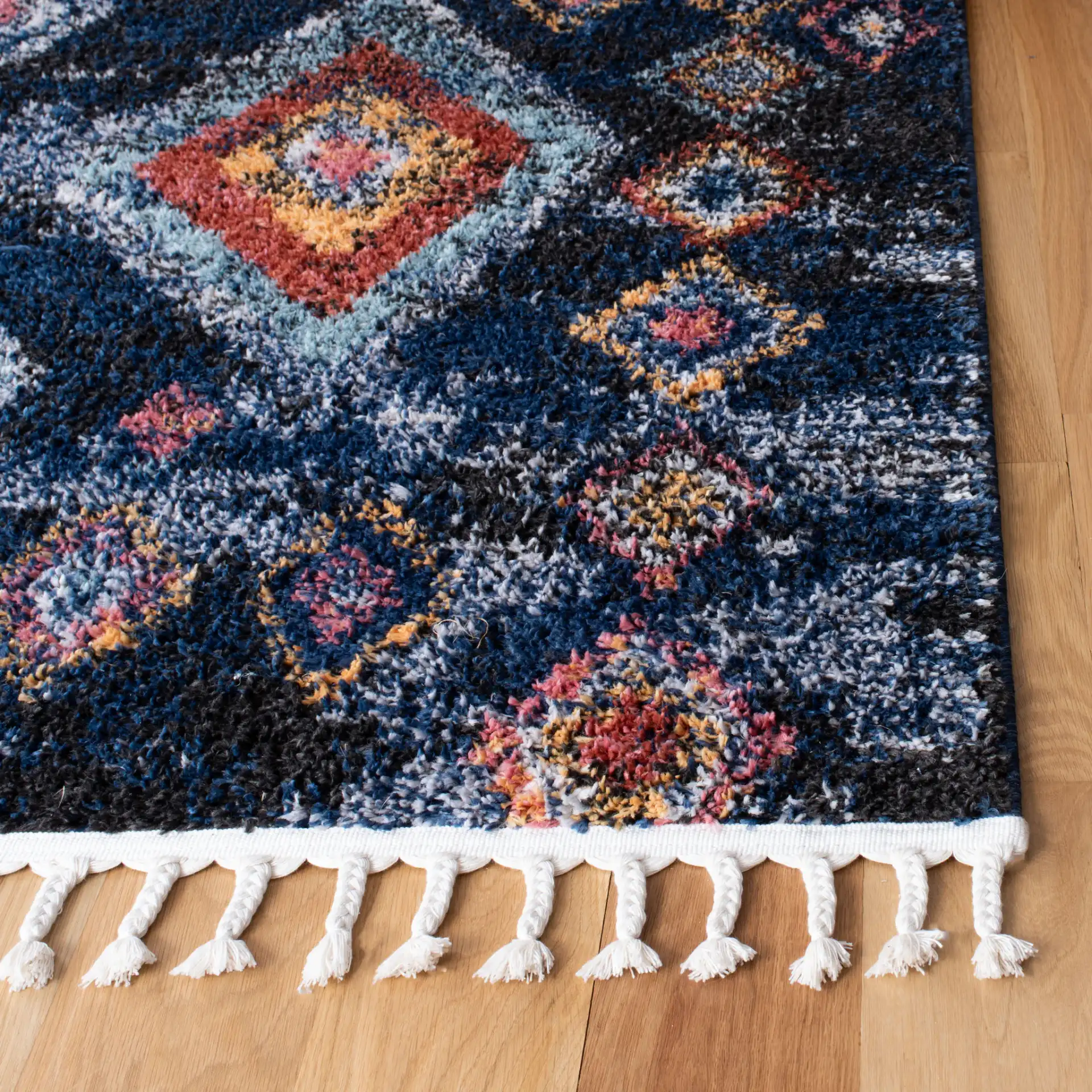 Morocco Nested Diamond Shag Rug in Navy / Multicolor in a styled room