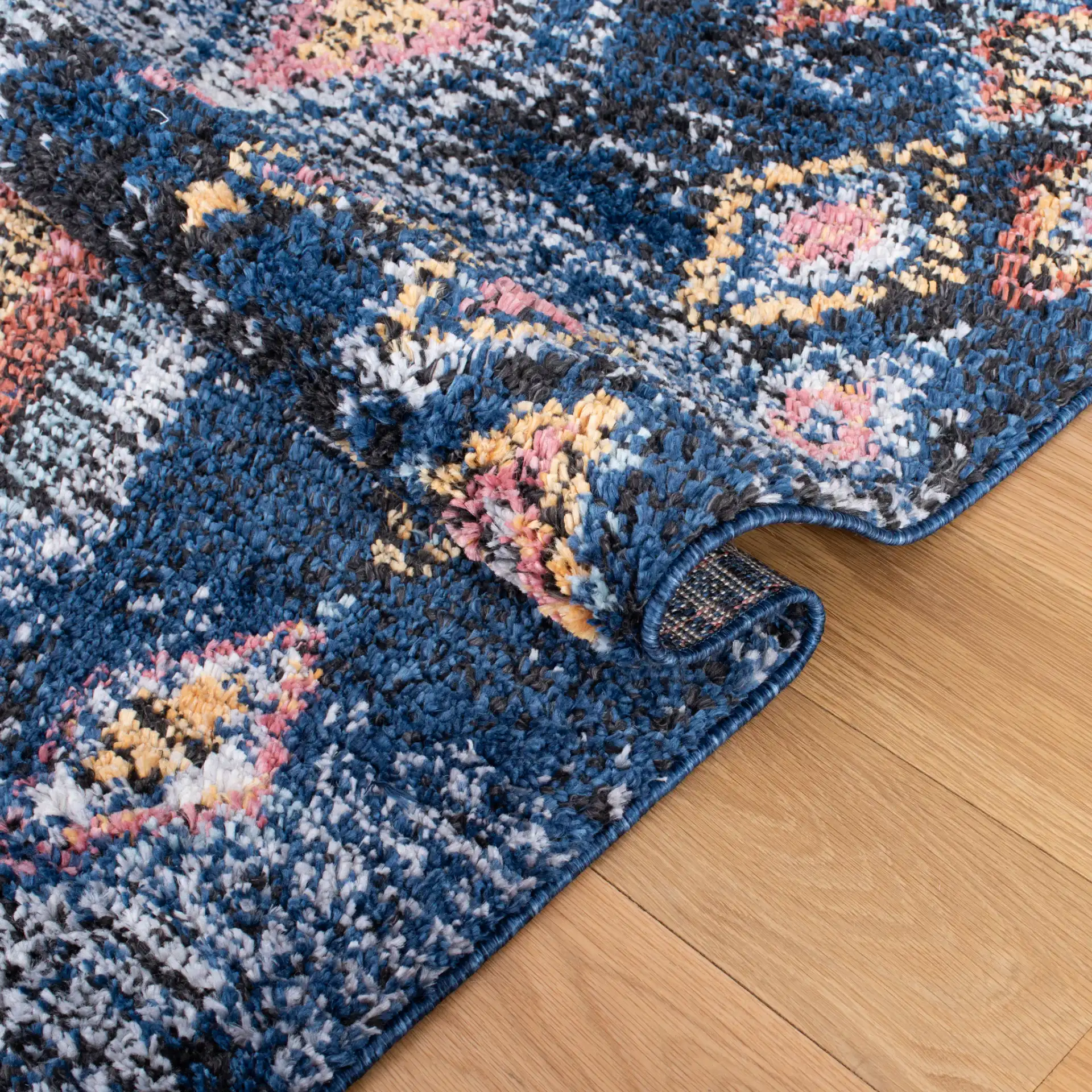 Morocco Nested Diamond Shag Rug in Navy / Multicolor in a styled room
