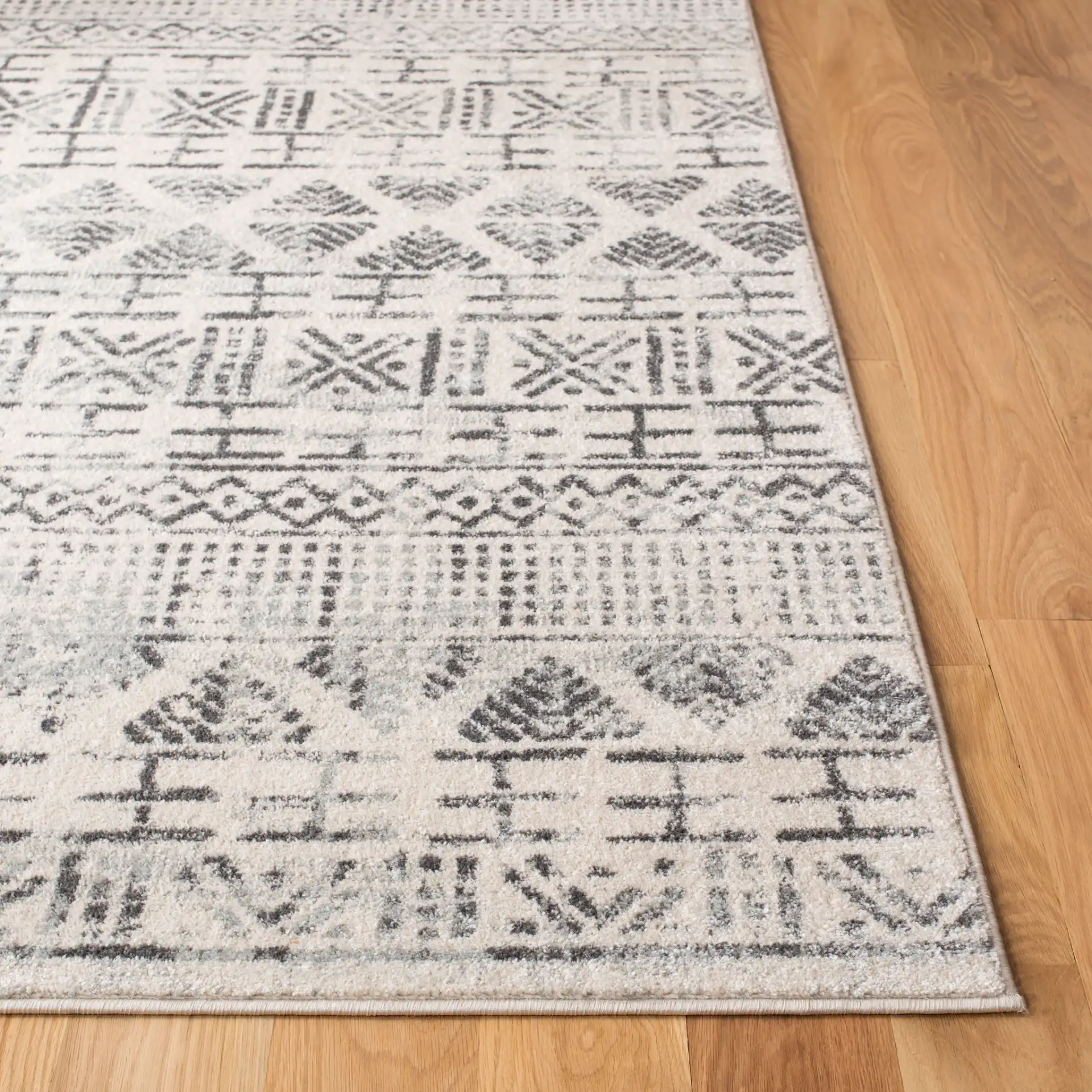 Mercer Banded Tribal Rug in Ivory / Gray in a styled room