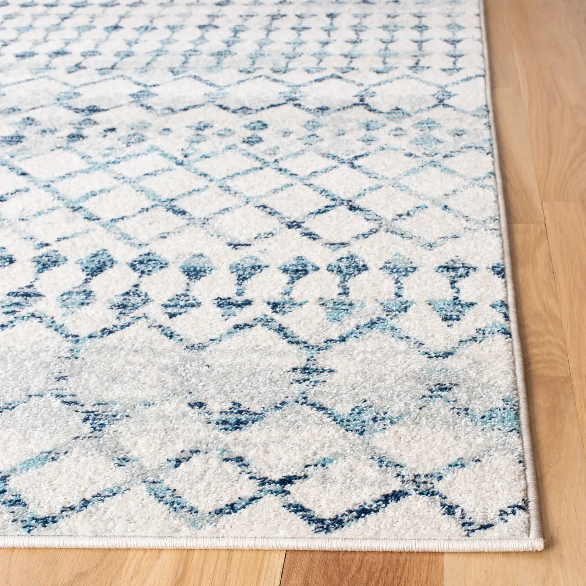 Mercer Lattice Band Rug in Ivory / Turquoise in a styled room