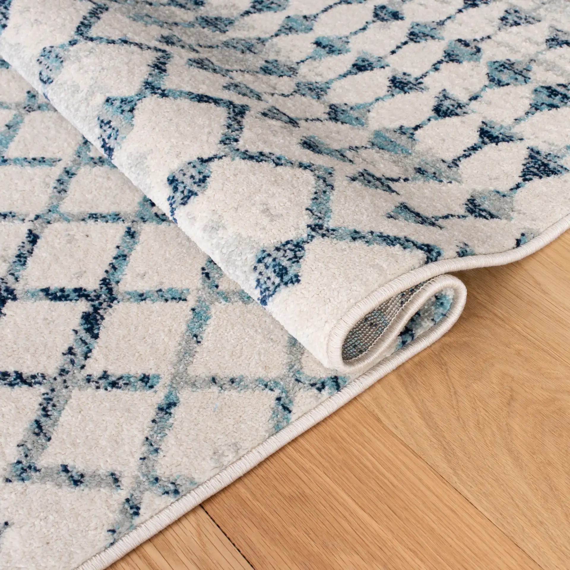 Mercer Lattice Band Rug in Ivory / Turquoise in a styled room