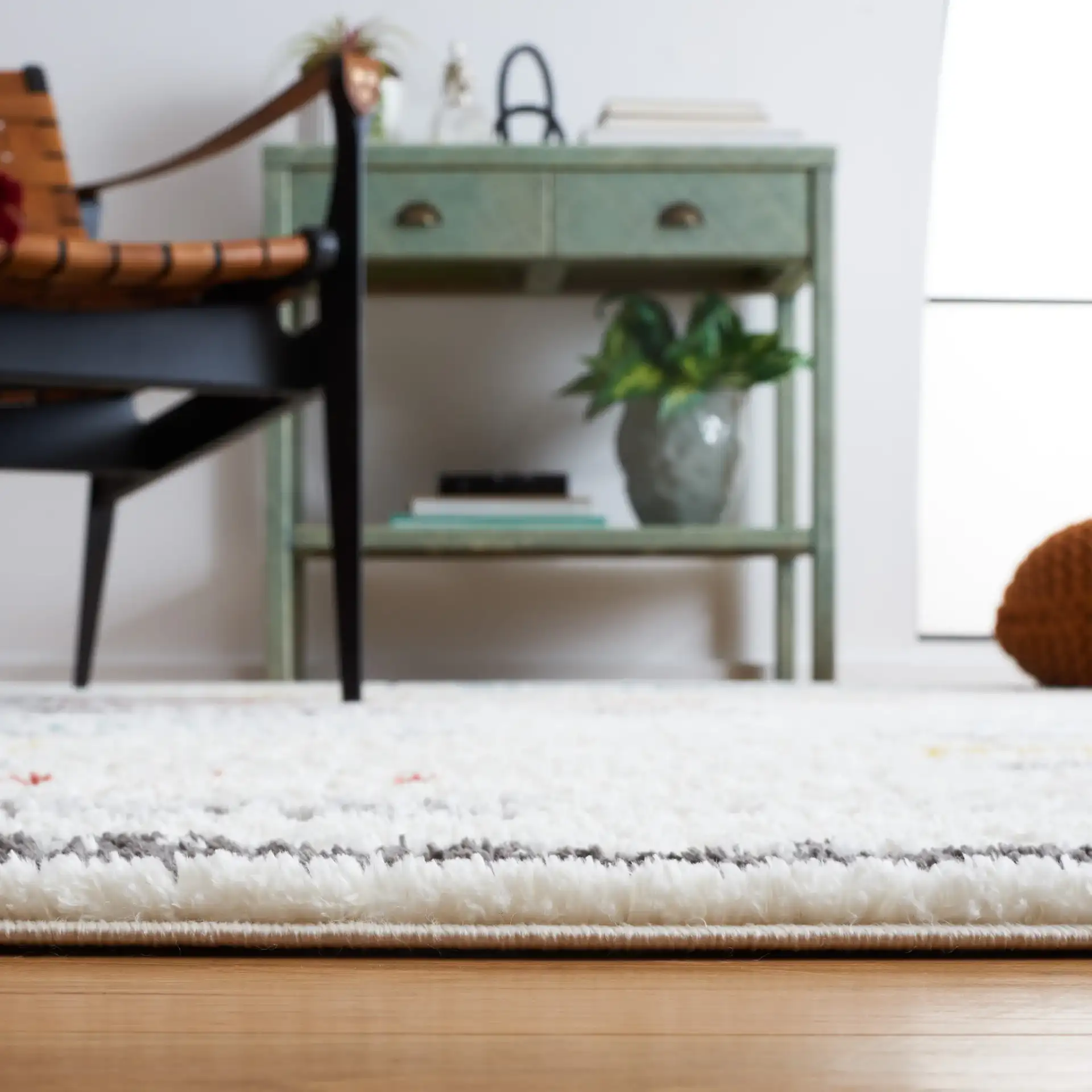 Marrakesh Dashed Stripe Rug in Ivory / Gray in a styled room
