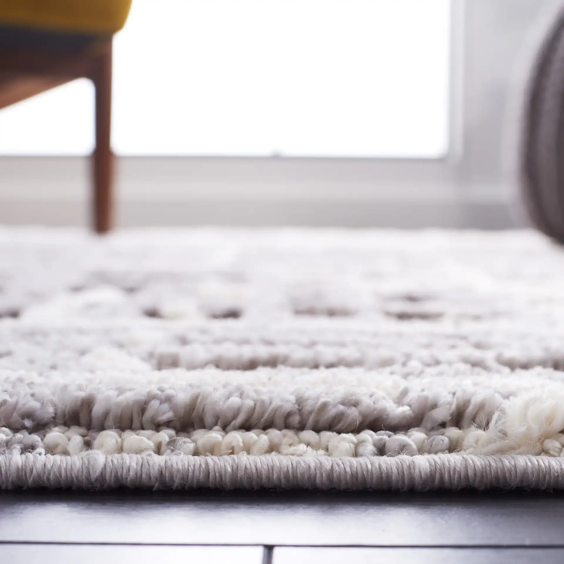 Marrakesh Abstract Grid Rug in Ivory / Dark Gray in a styled room