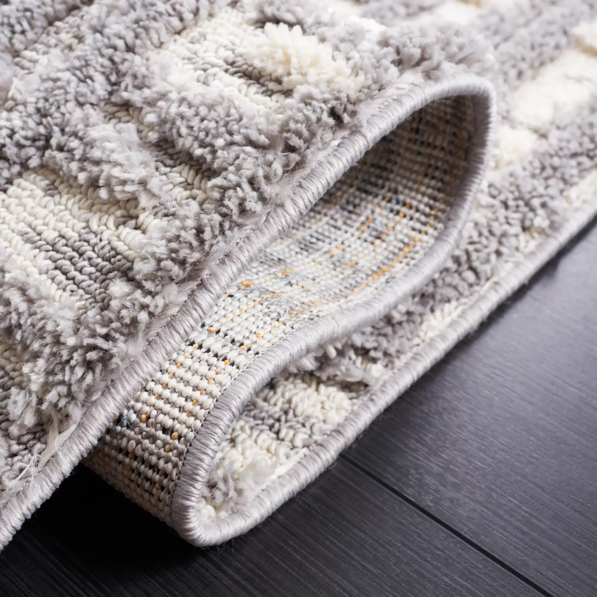 Marrakesh Abstract Grid Rug in Ivory / Dark Gray in a styled room