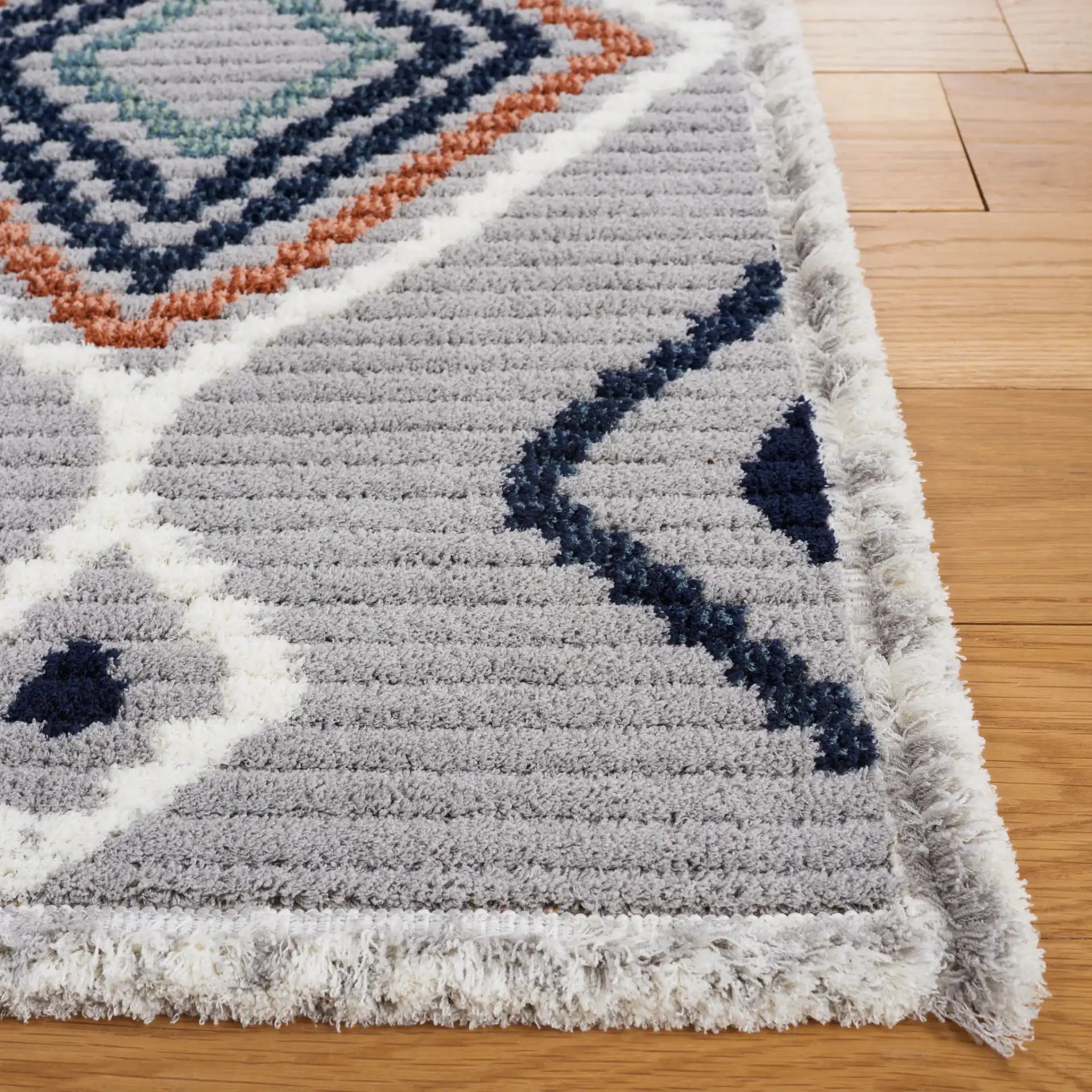 Marrakesh Tribal Diamond Lattice Rug in Gray / Blue Rust in a styled room