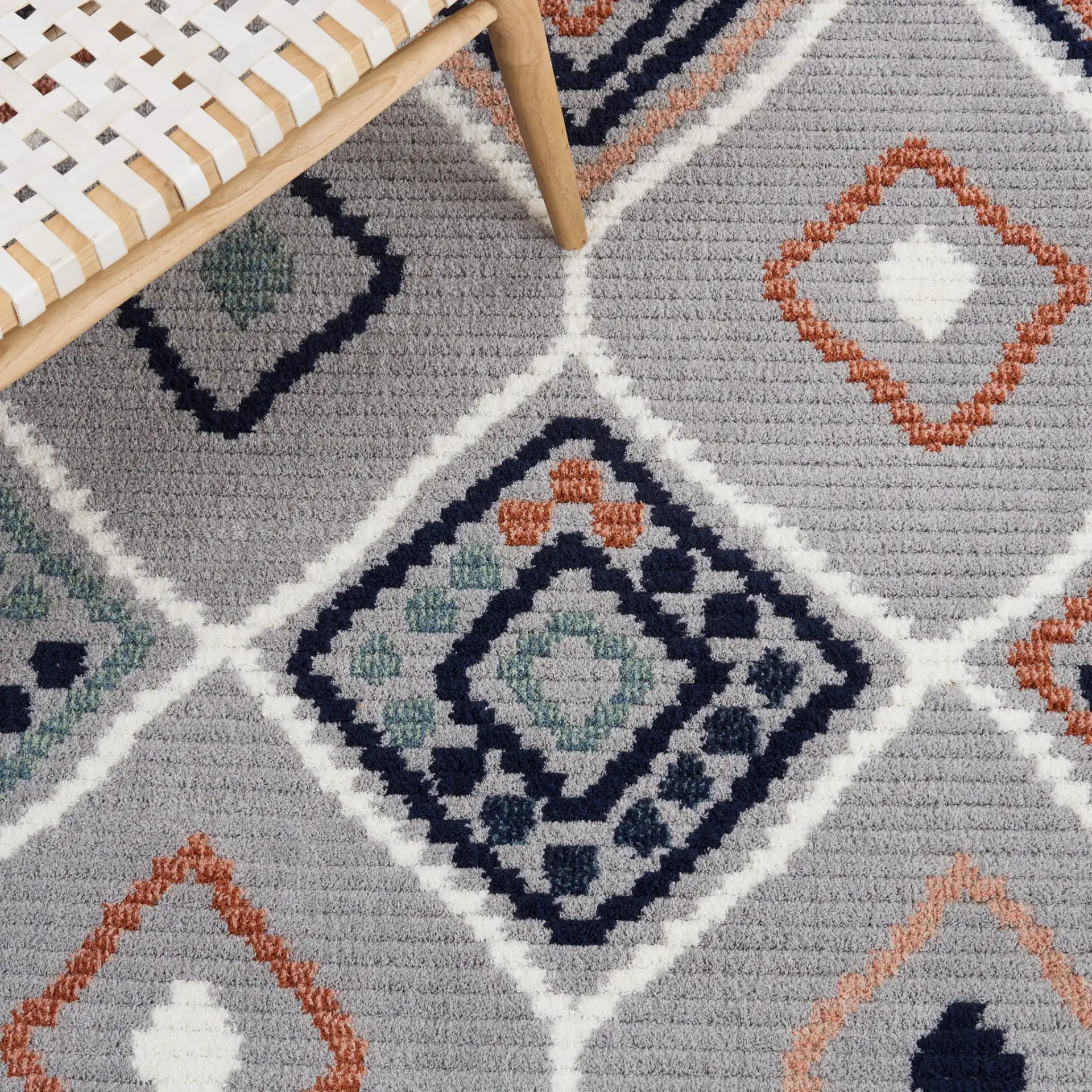 Marrakesh Tribal Diamond Lattice Rug in Gray / Blue Rust in a styled room