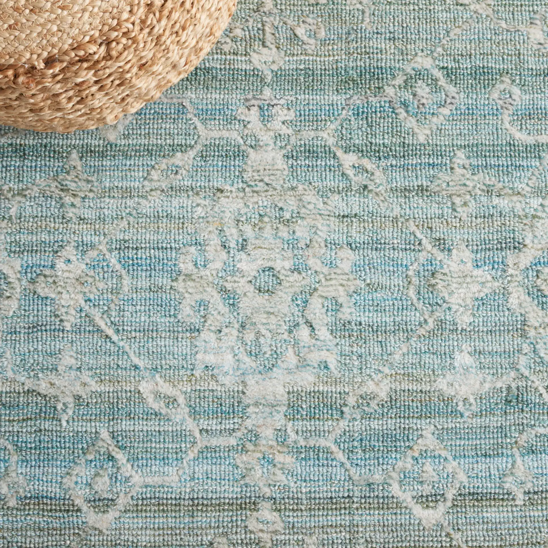 Marquee Floral Medallion Hand-Tufted Rug in Turquoise / Gray in a styled room