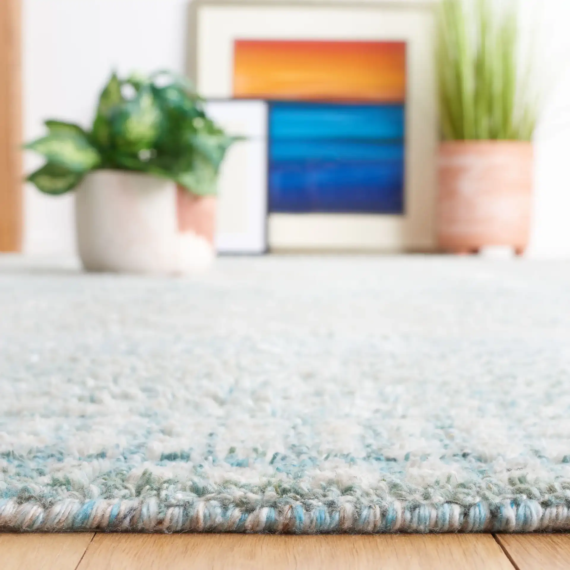 Marquee Interlocking Line Hand-Tufted Rug in Turquoise / Gray in a styled room