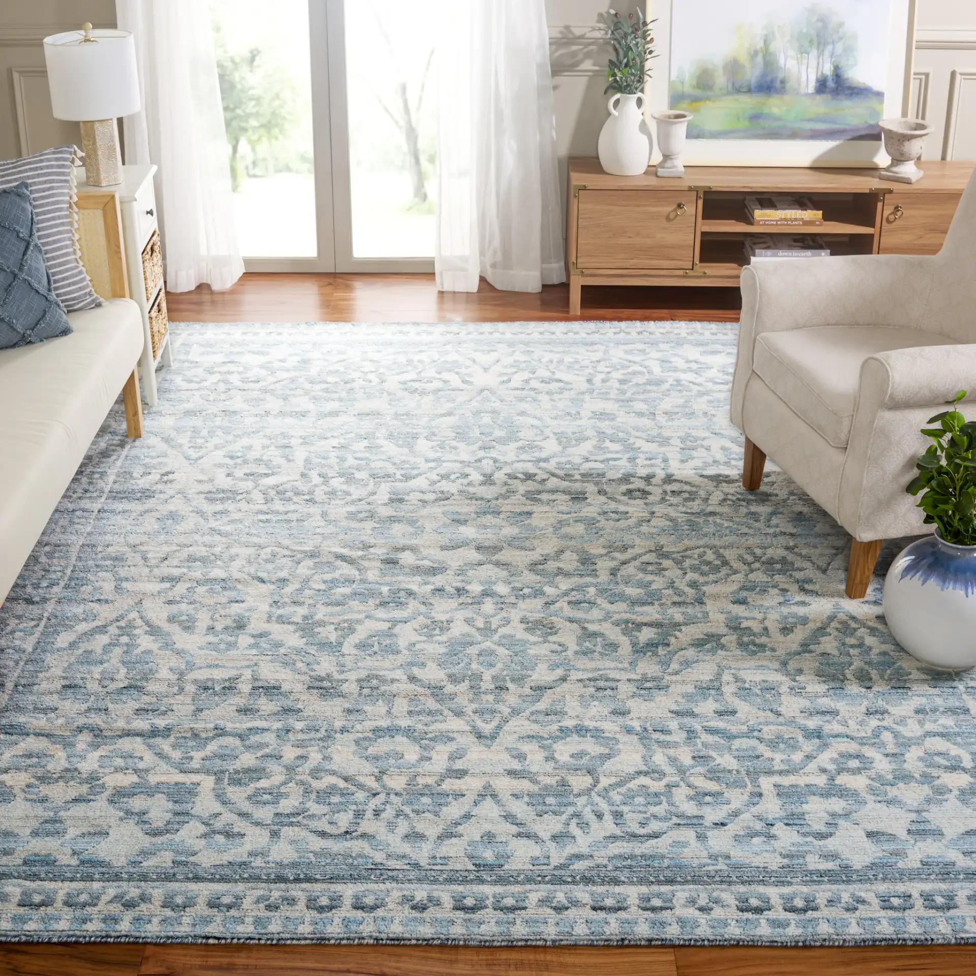 Marquee Faded Damask Hand-Tufted Rug in Blue / Gray in a styled room