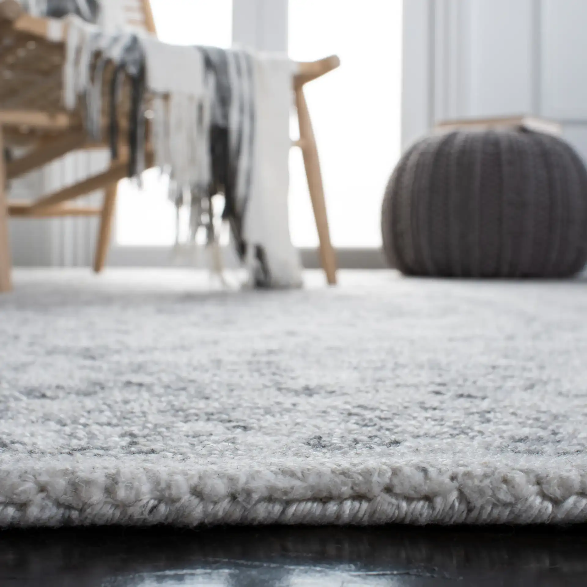 Marquee Faded Medallion Hand-Tufted Rug in Ivory / Gray in a styled room