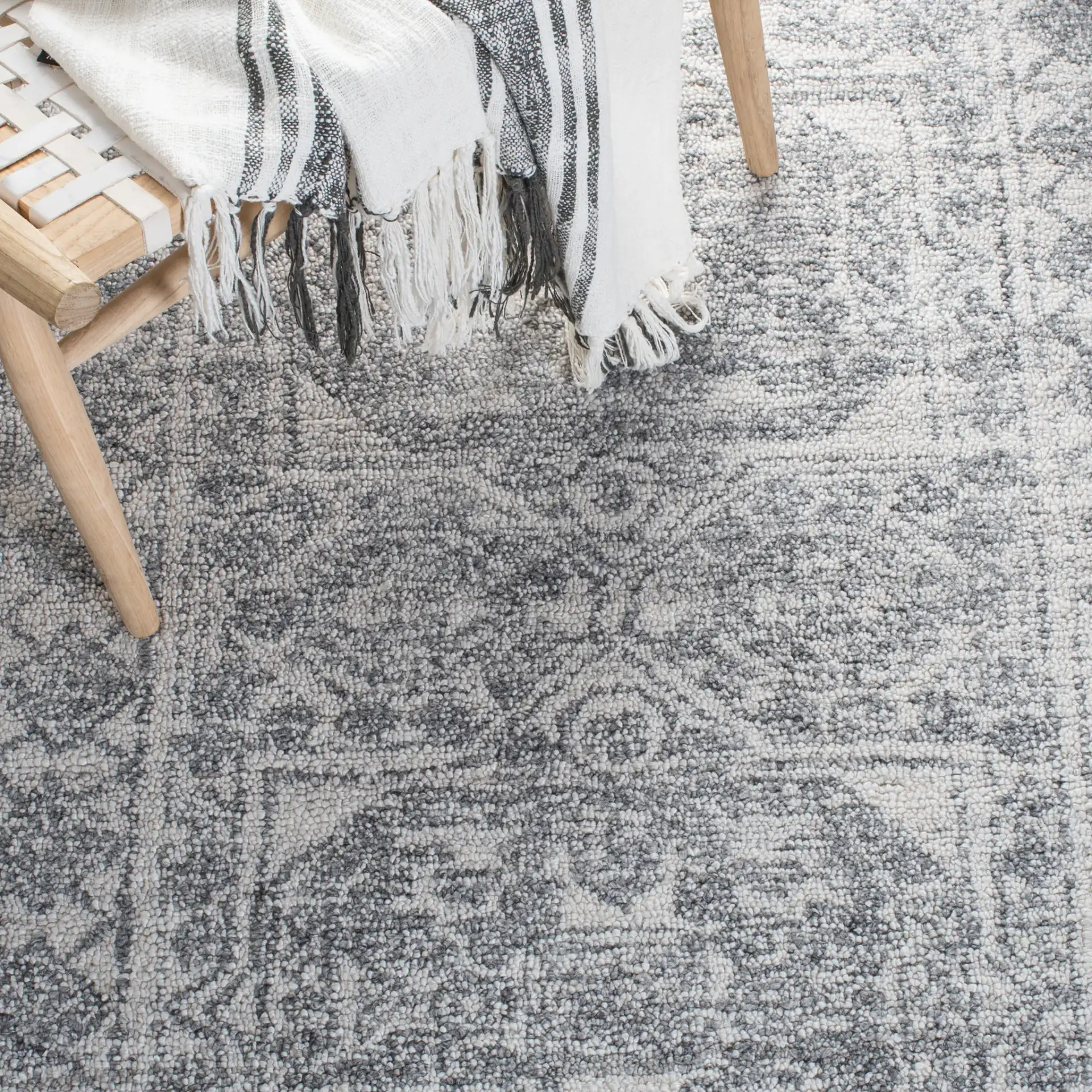 Marquee Faded Medallion Hand-Tufted Rug in Ivory / Gray in a styled room