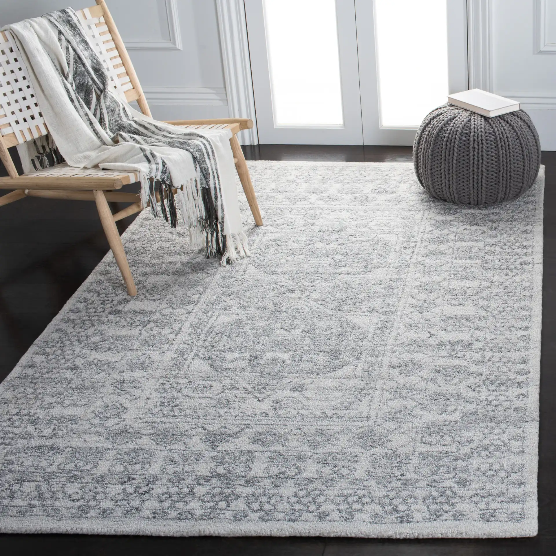 Marquee Faded Medallion Hand-Tufted Rug in Ivory / Gray in a styled room