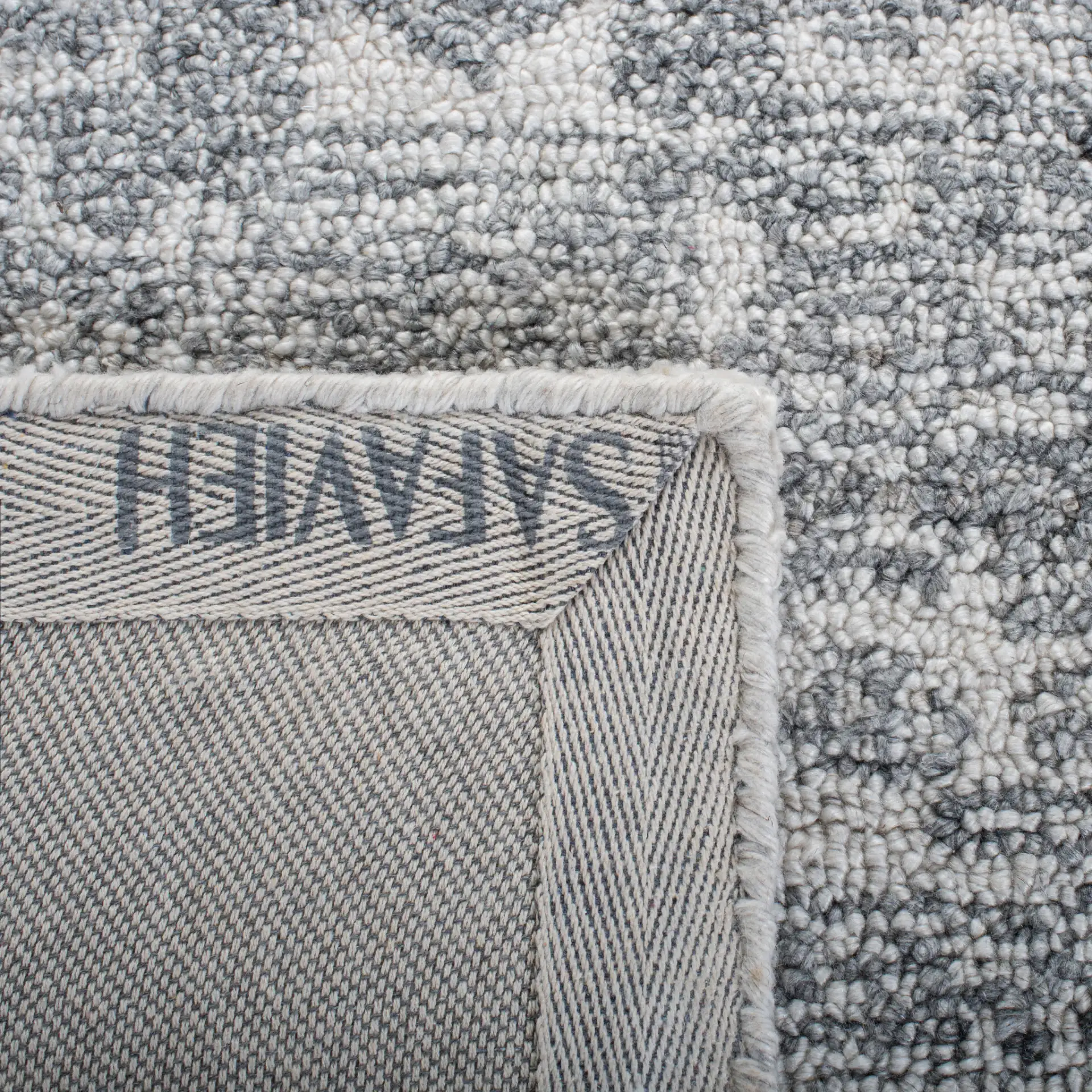 Marquee Faded Medallion Hand-Tufted Rug in Ivory / Gray in a styled room