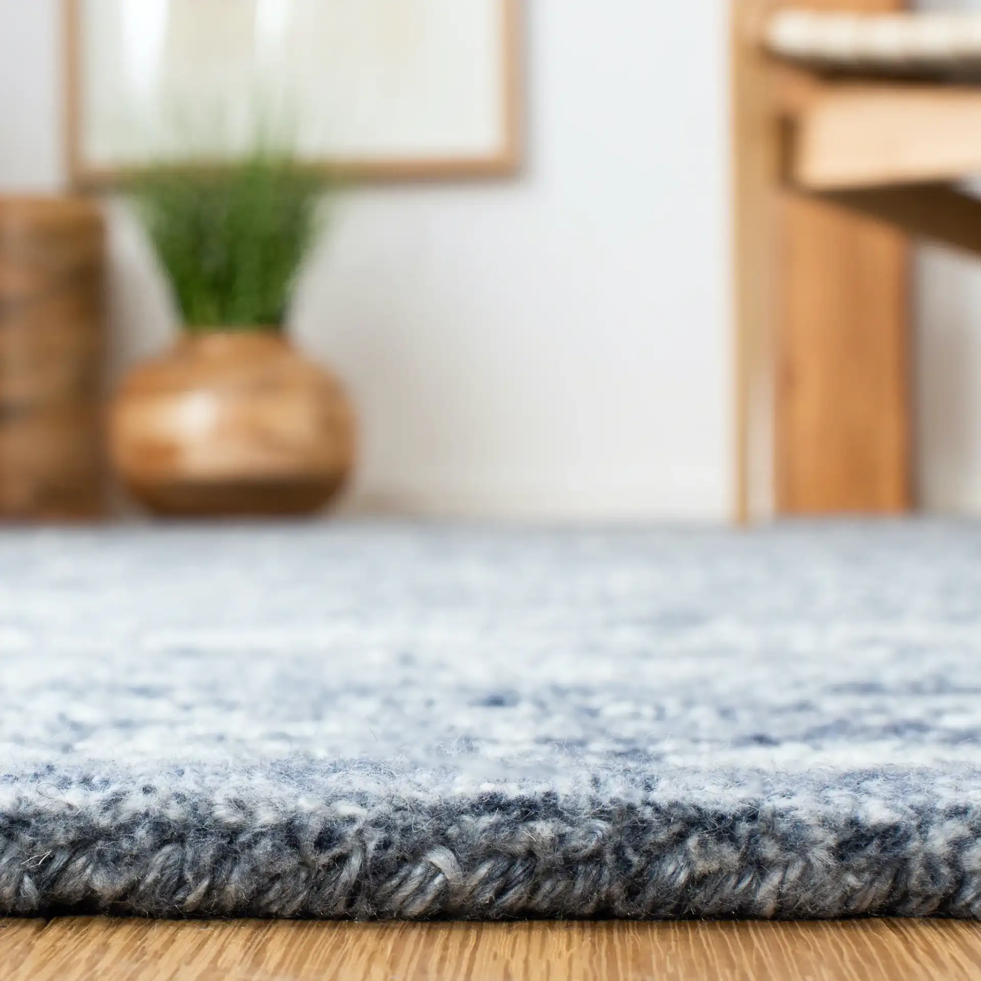 Marquee Framed Medallion Hand-Tufted Rug in Navy in a styled room