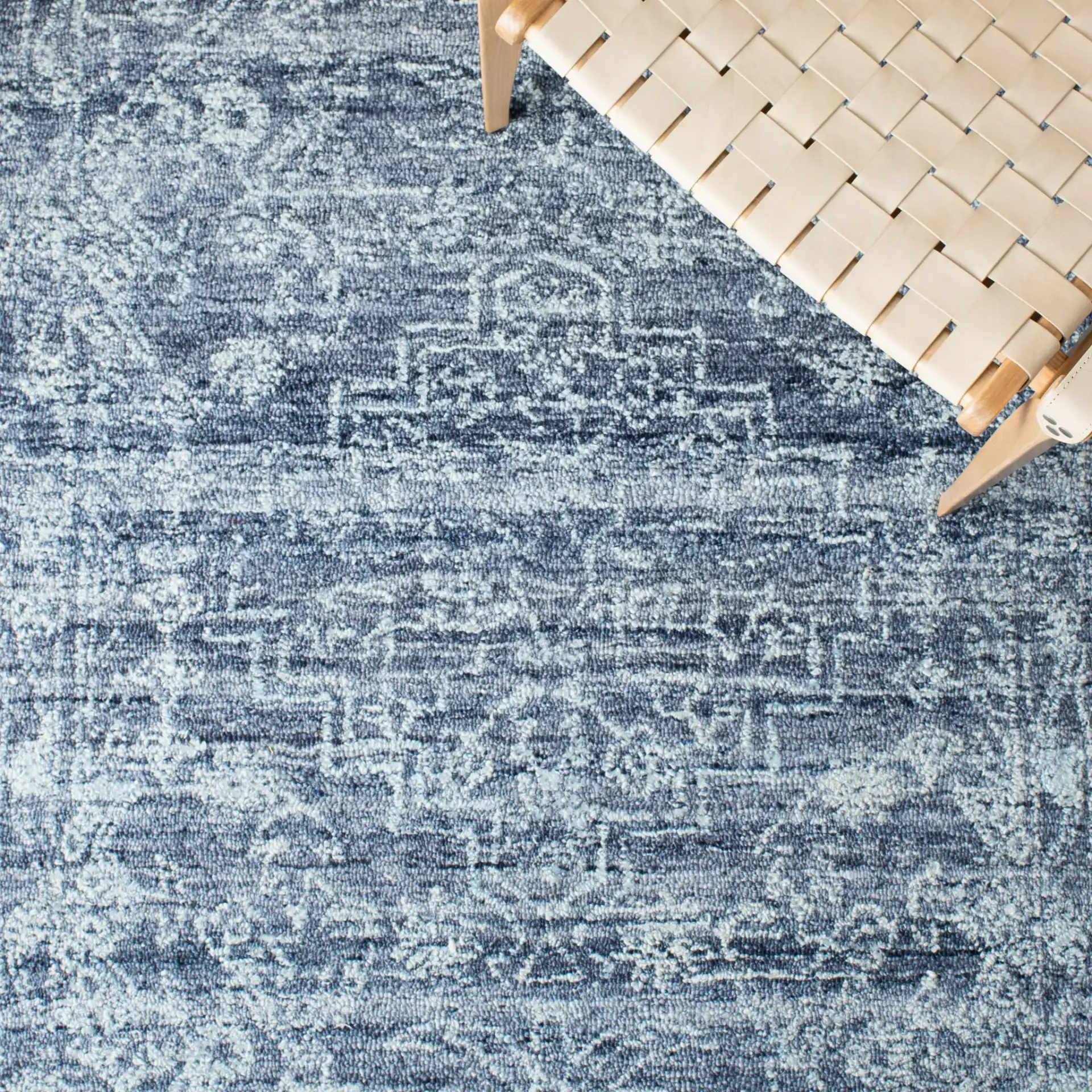Marquee Framed Medallion Hand-Tufted Rug in Navy in a styled room