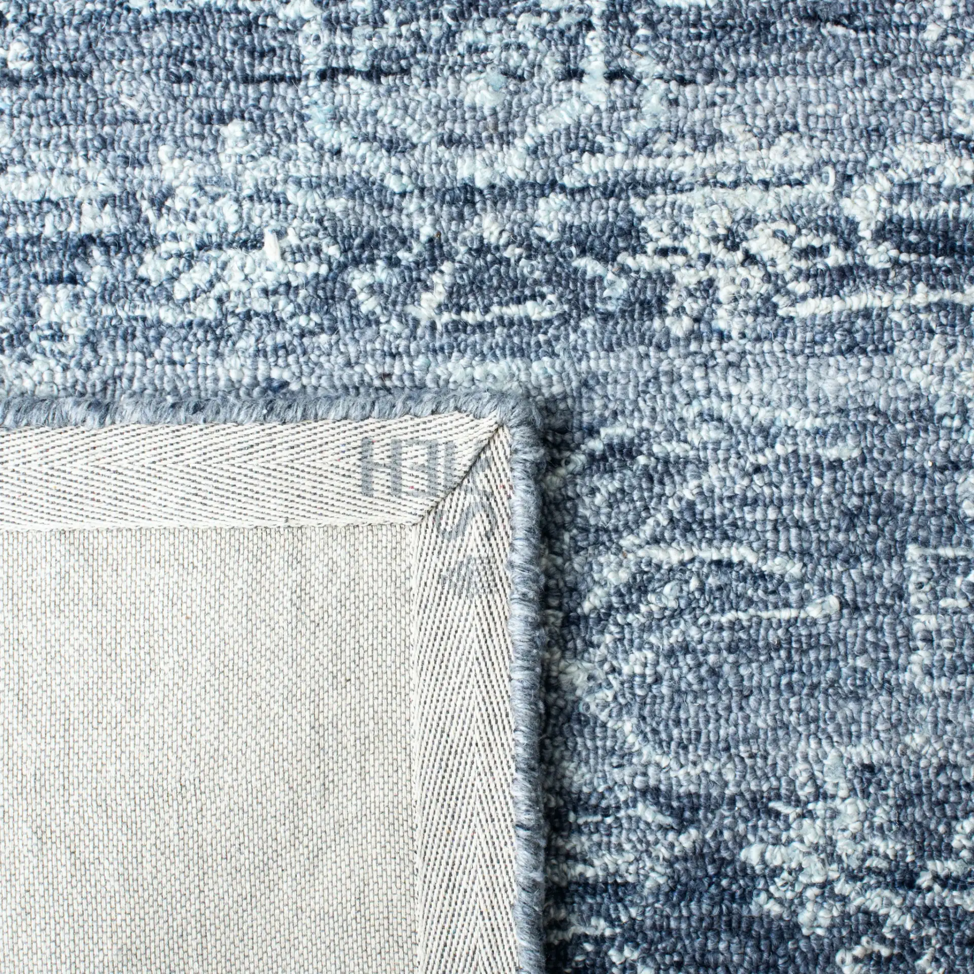 Marquee Framed Medallion Hand-Tufted Rug in Navy in a styled room